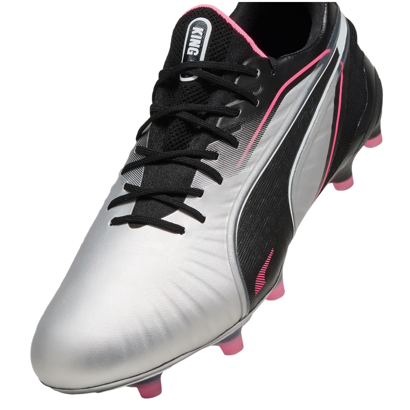 A silver and black Puma King soccer cleat with vibrant pink accents on the trim and studs.