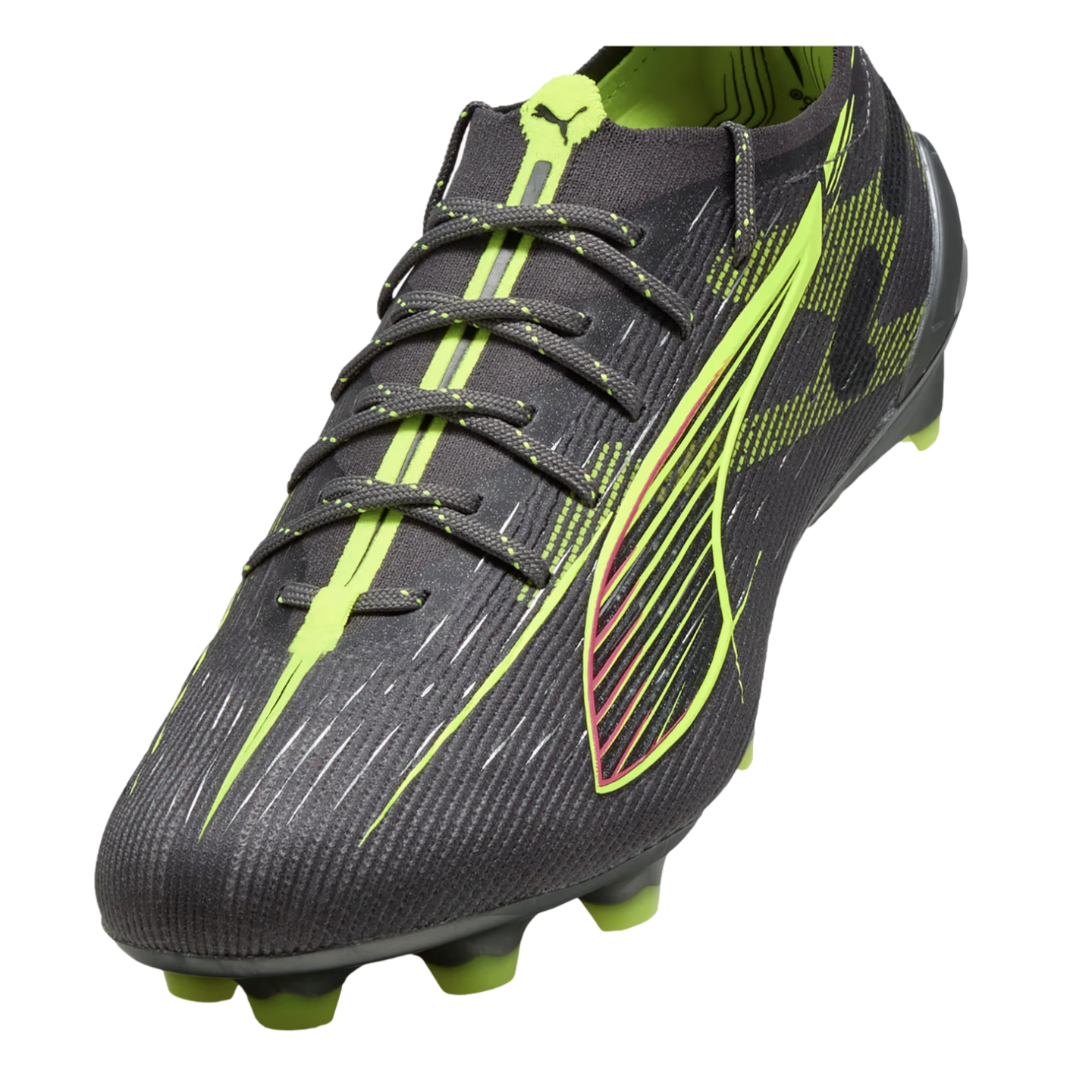 A charcoal Puma soccer cleat with neon green and pink accents, featuring a textured upper and green studs.