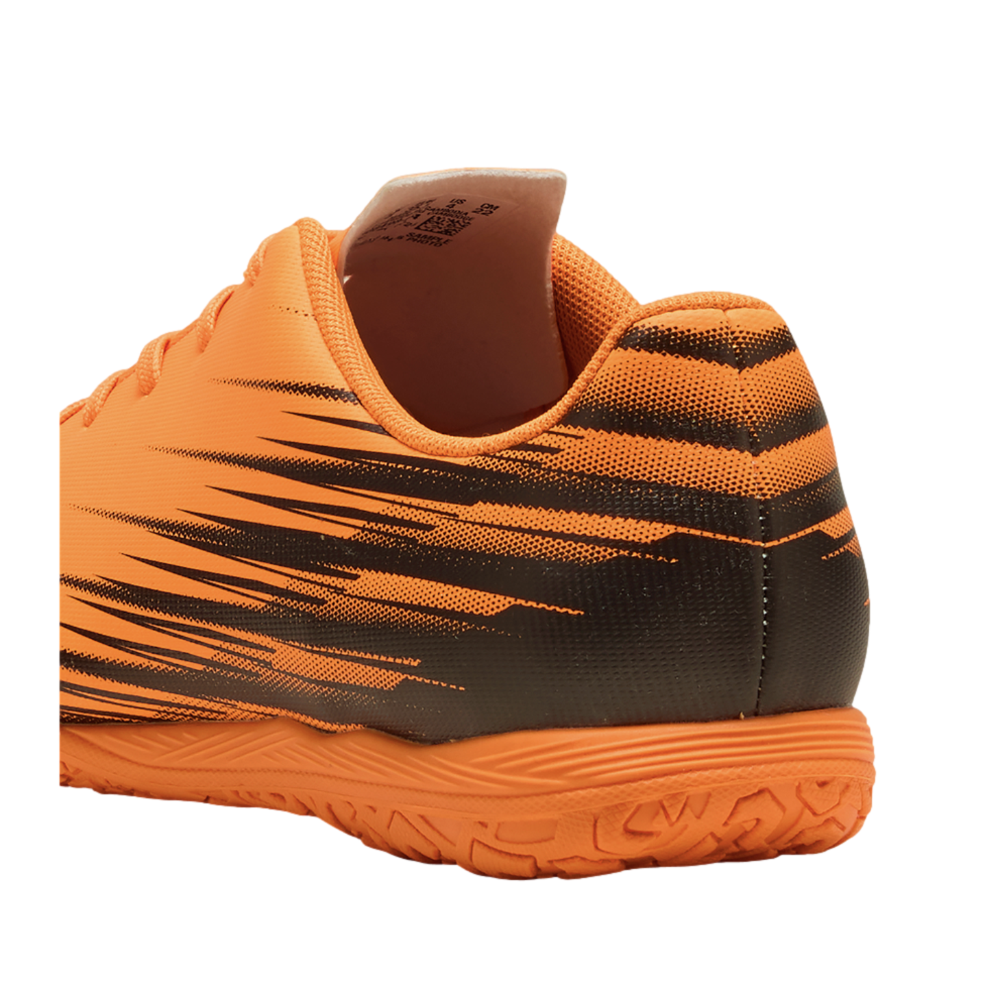 Rear-side view of an orange and black athletic shoe with graphic patterns and a textured sole, set against a solid black background.
