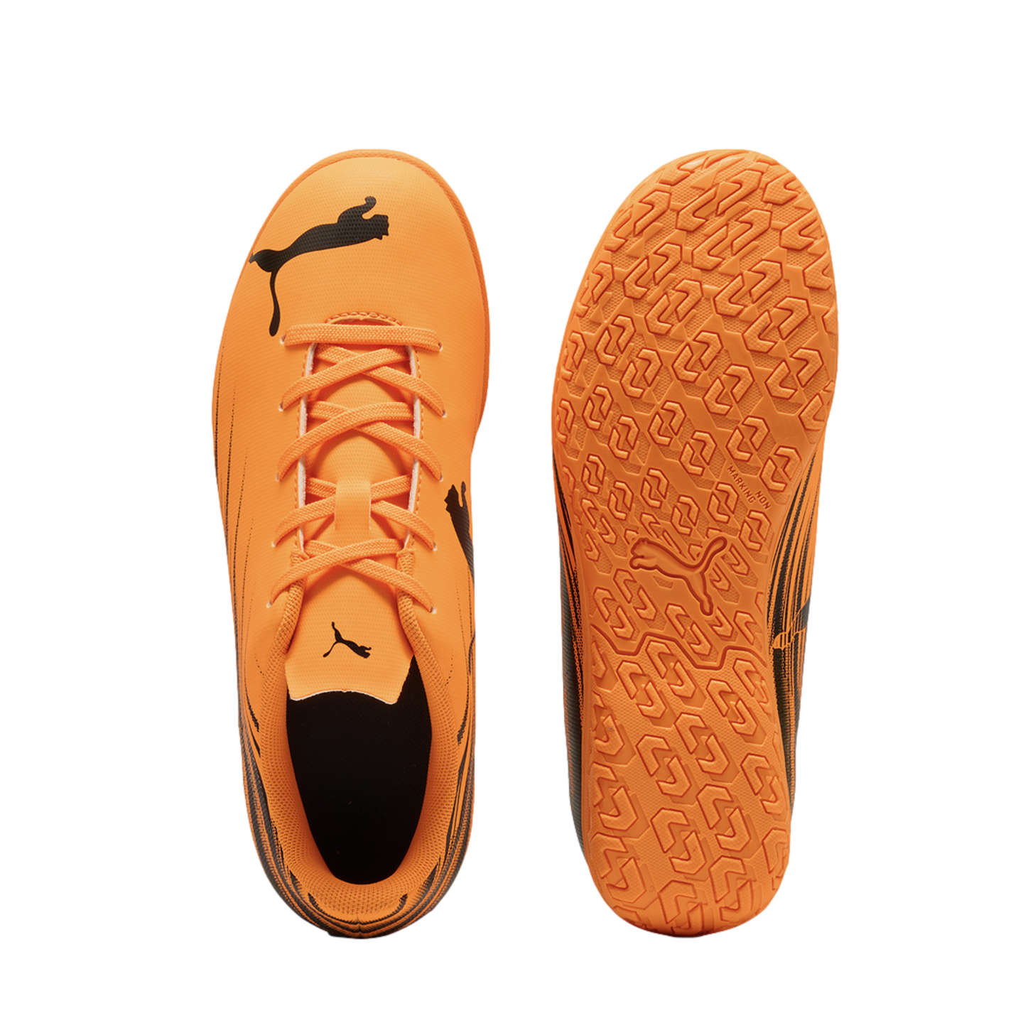 Top and sole views of an orange Puma indoor soccer shoe with black logos on a black background.