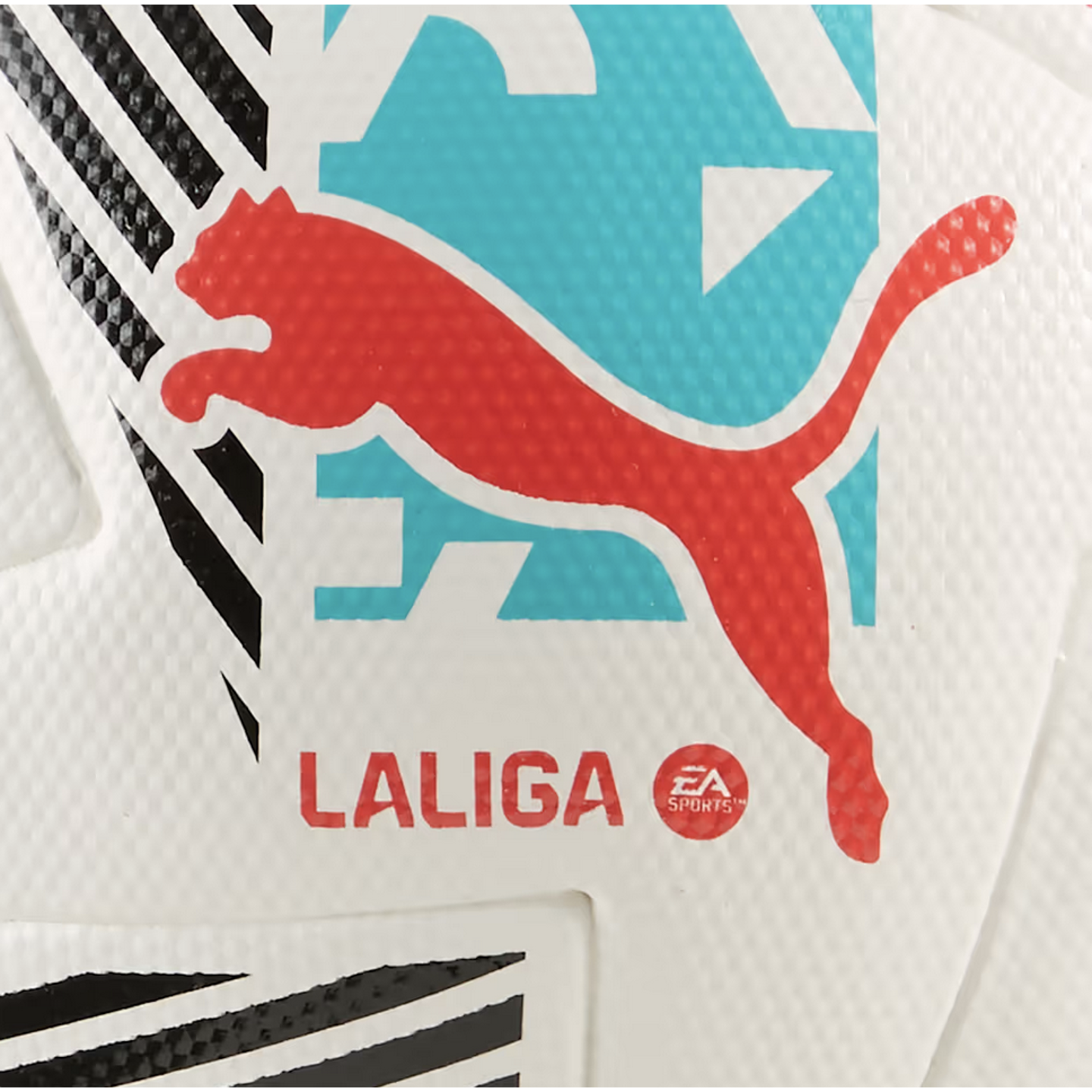Close-up of a white textured soccer ball featuring a red Puma logo, the LALIGA name, and an EA SPORTS emblem. It includes light blue graphics and black patterned stripes.