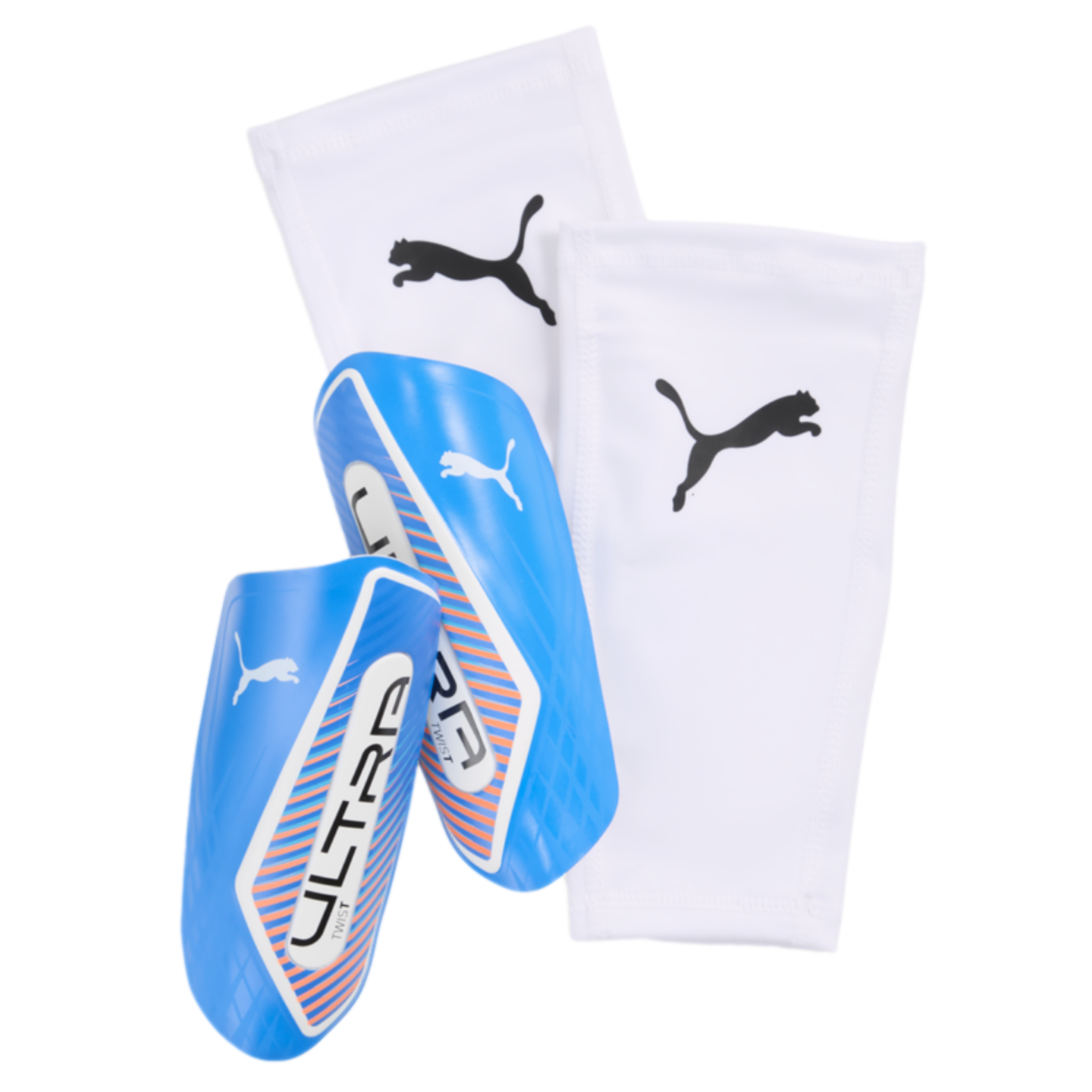 A pair of blue Puma Ultra Twist shin guards with white and orange accents, alongside two white Puma shin guard sleeves.