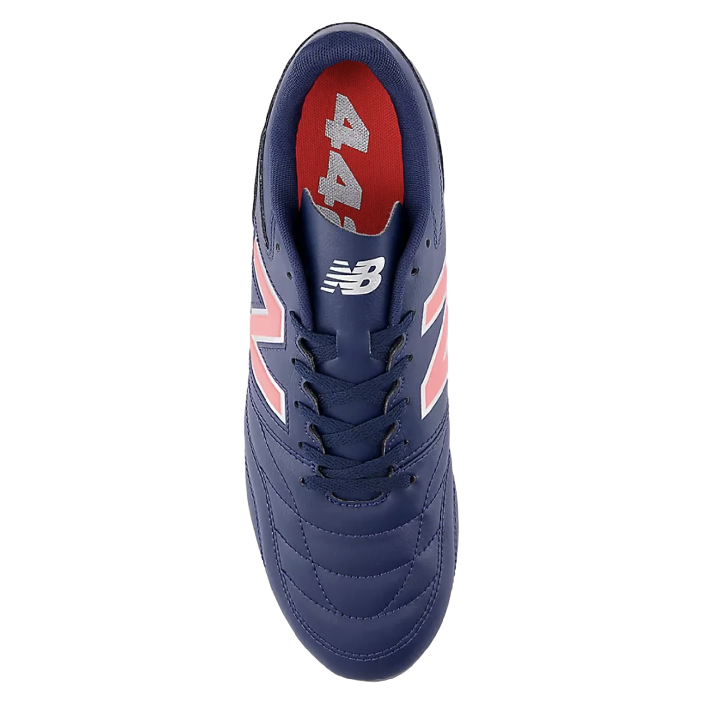Top-down view of a navy blue New Balance 442 soccer cleat featuring a quilted leather upper, coral "N" logos, and a red insole, set against a black background.