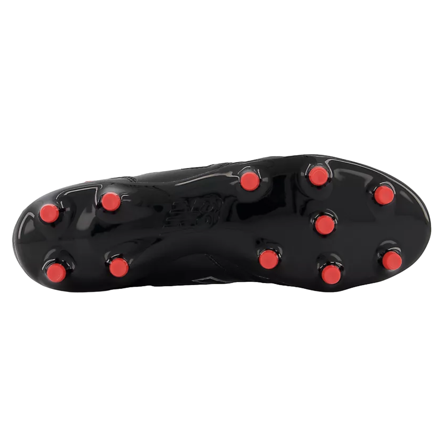 Sole of a glossy black New Balance soccer cleat featuring red circular studs, viewed against a black background.