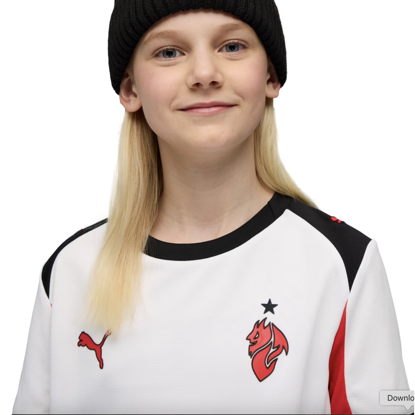 A smiling young person with blonde hair wearing a black beanie and a white Puma athletic jersey against a black background.