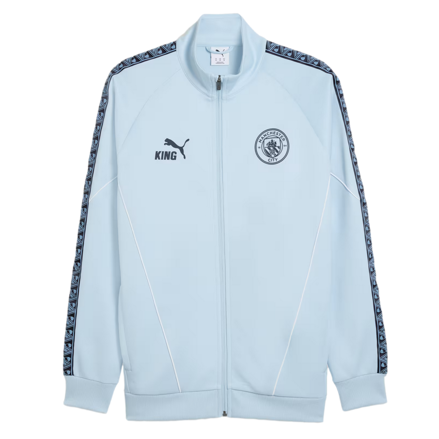 Light blue Puma King zip-up jacket featuring the Manchester City FC crest, patterned sleeve trim, and white piping accents.