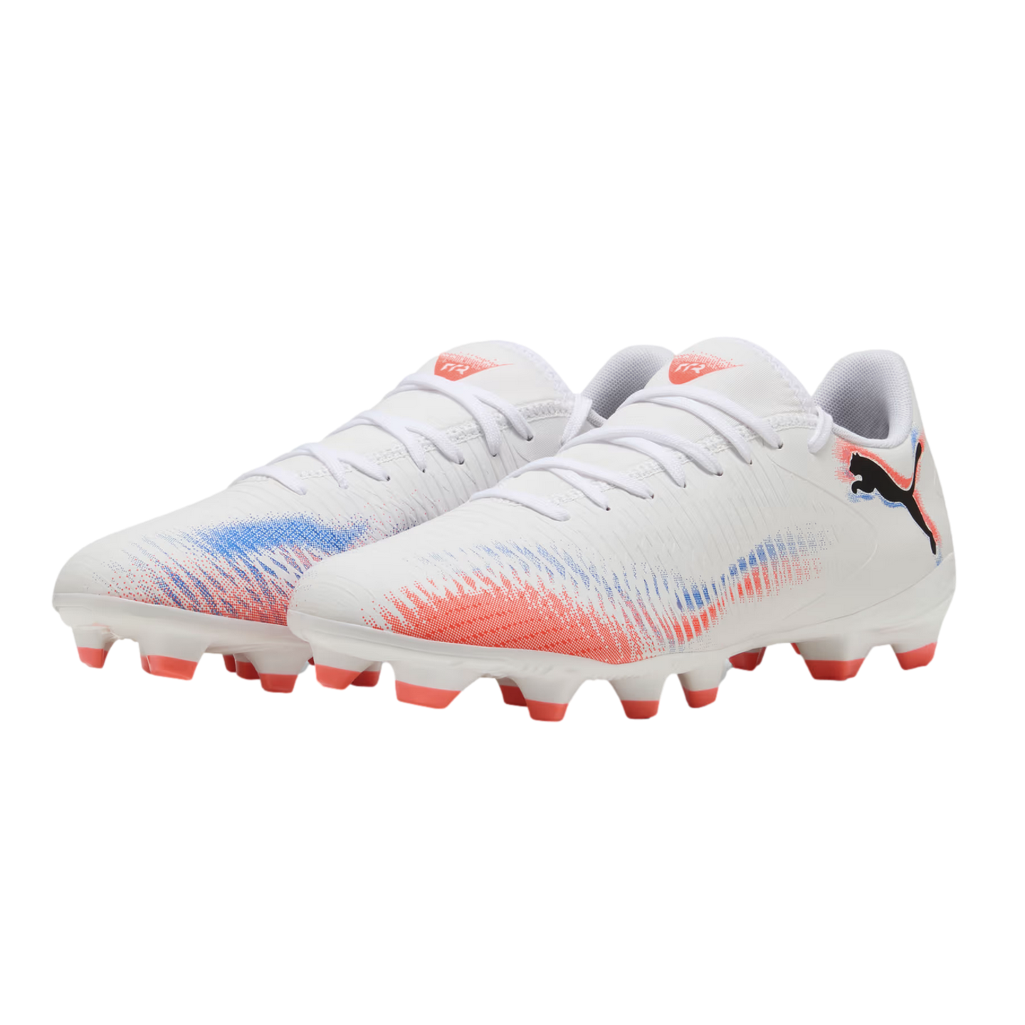 White Puma soccer cleats with red and blue spray-paint patterns on the sides, white laces, and red-tipped studs, shown against a solid black background.