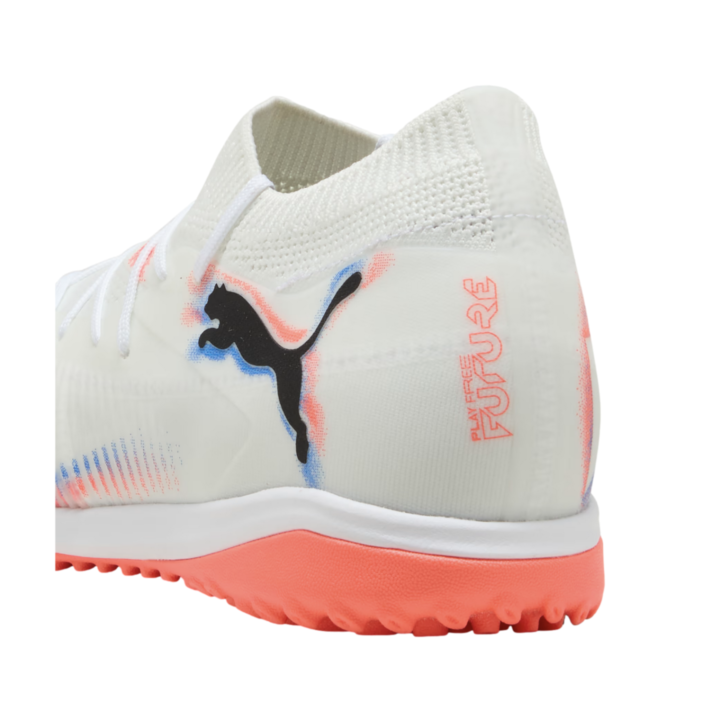 White Puma Future soccer turf shoe with black logo, coral and blue accents, and a bright coral studded rubber outsole.