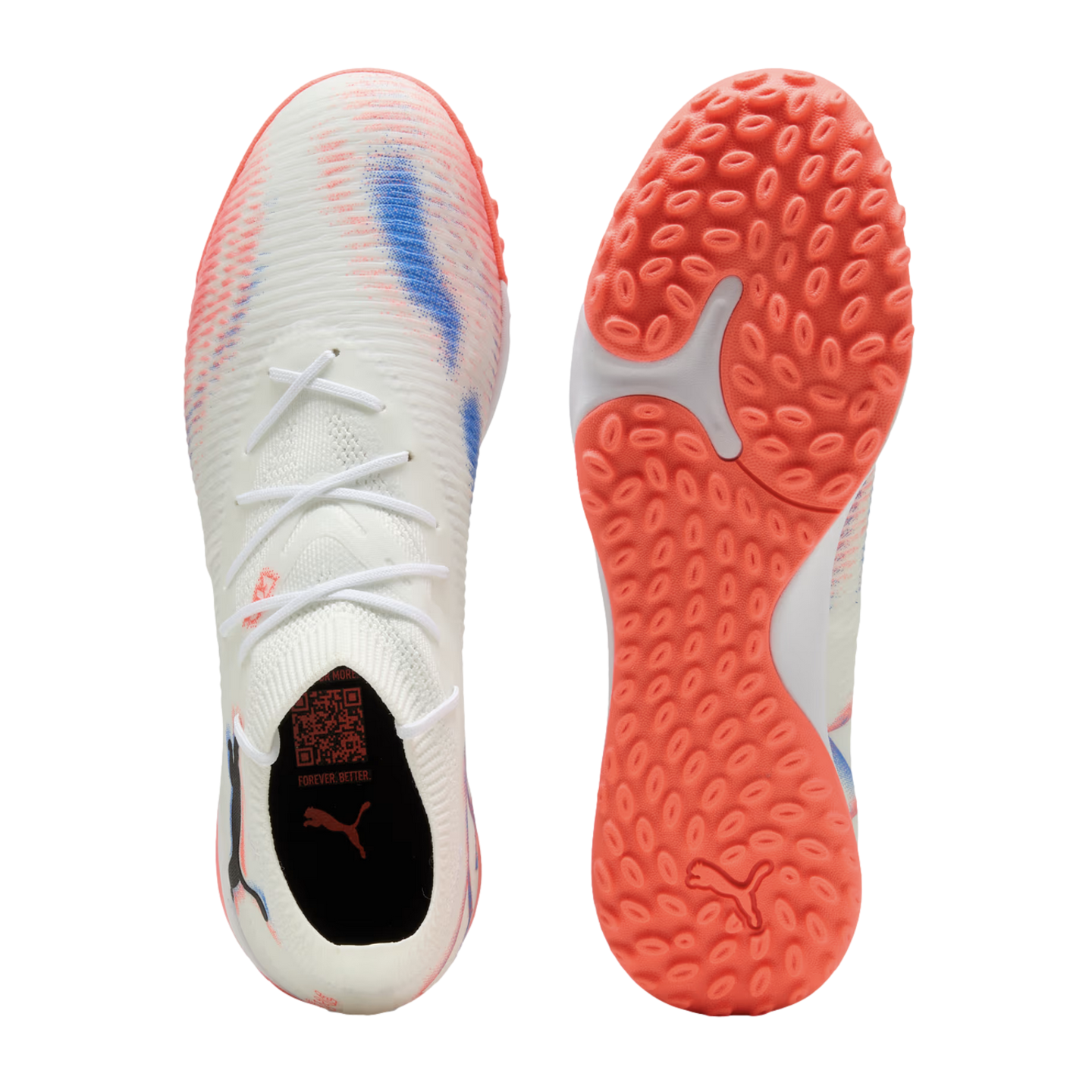 Top and sole view of a white Puma turf soccer shoe with pink and blue accents. It features a white knitted upper, sock-like collar, and a textured orange rubber outsole.