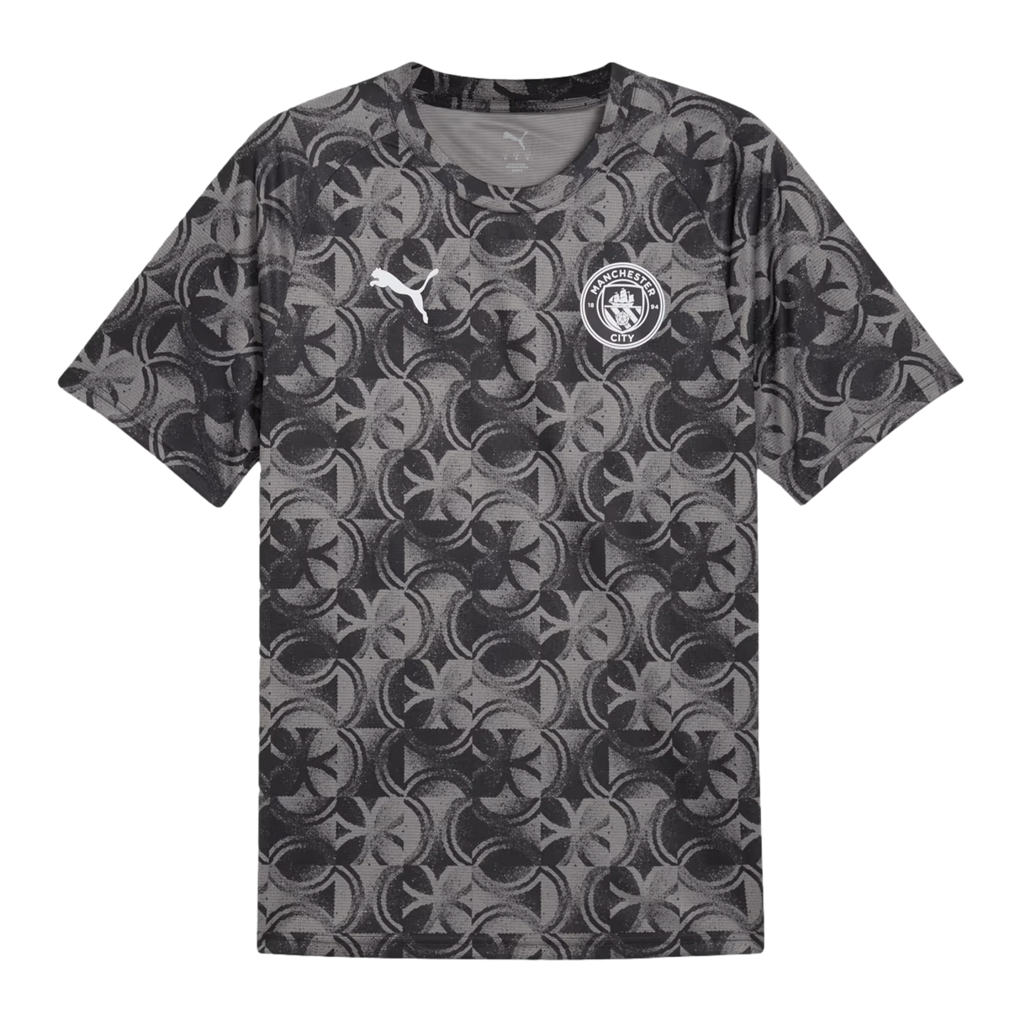 Grey short-sleeved t-shirt with a repeating black circular pattern, a white Puma logo on the right chest, and a Manchester City crest on the left.