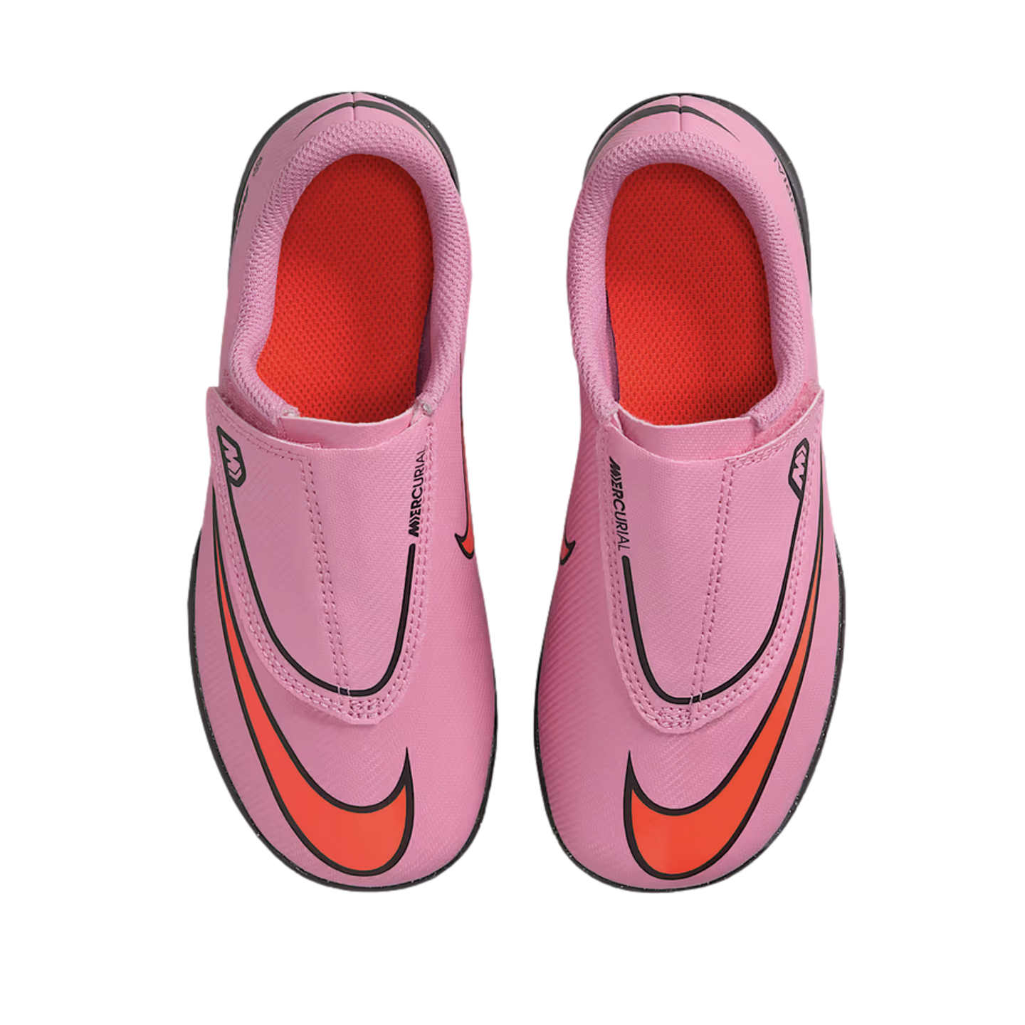Top-down view of a pair of pink Nike Mercurial soccer cleats with bright orange accents on a black background.