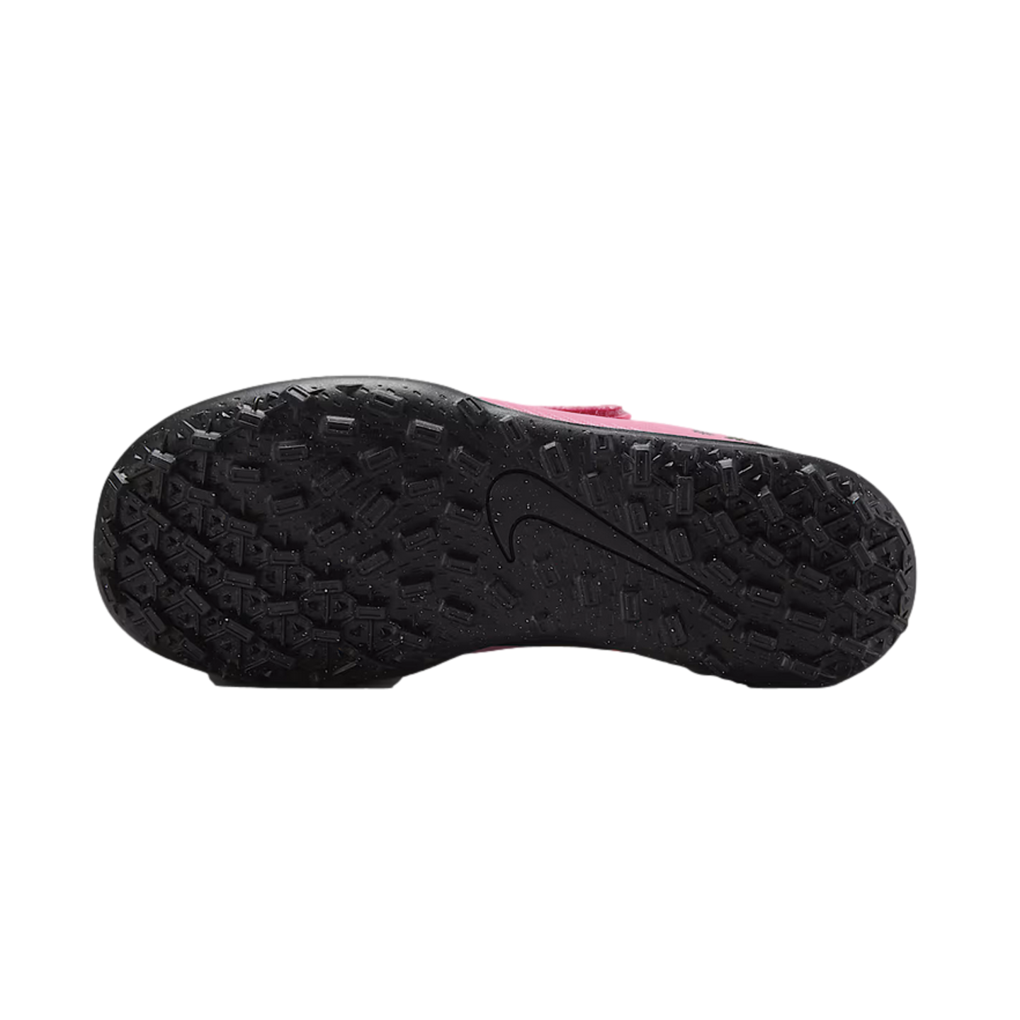 Bottom view of a black studded outsole of a pink Nike turf soccer shoe with a large Nike swoosh logo in the center.