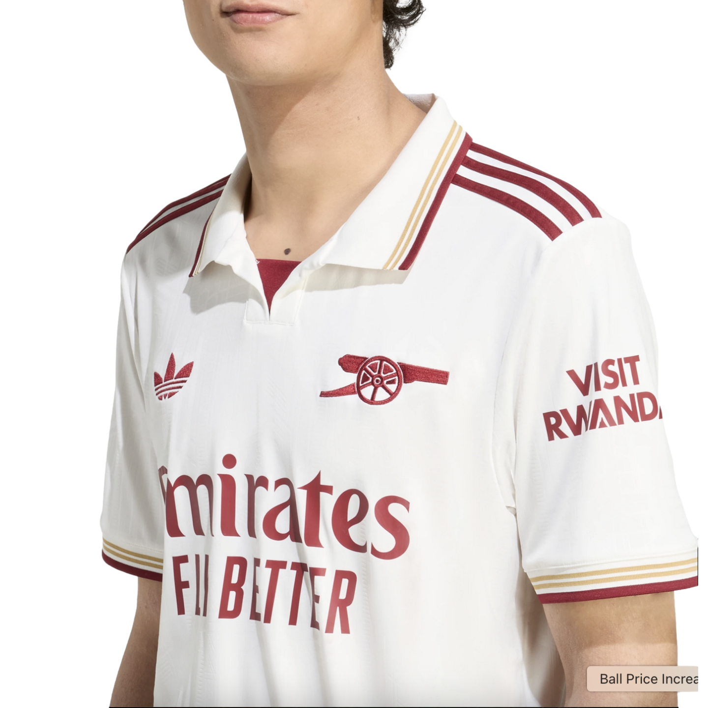 White and maroon Arsenal FC soccer jersey with Adidas and Emirates branding, featuring a polo collar and the club's cannon crest.
