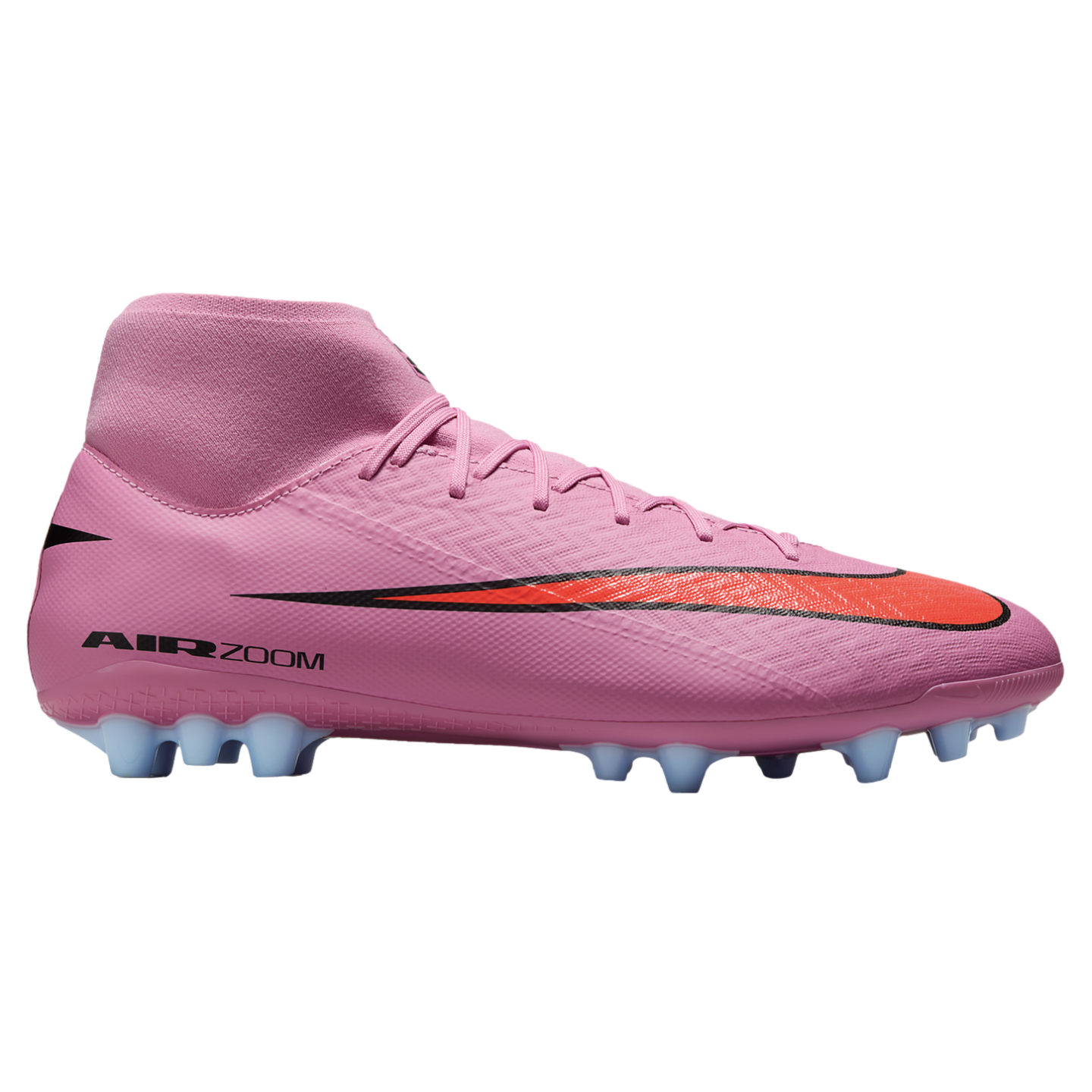 Side view of a pink high-top Nike soccer cleat with a red swoosh and light blue studs on a black background.