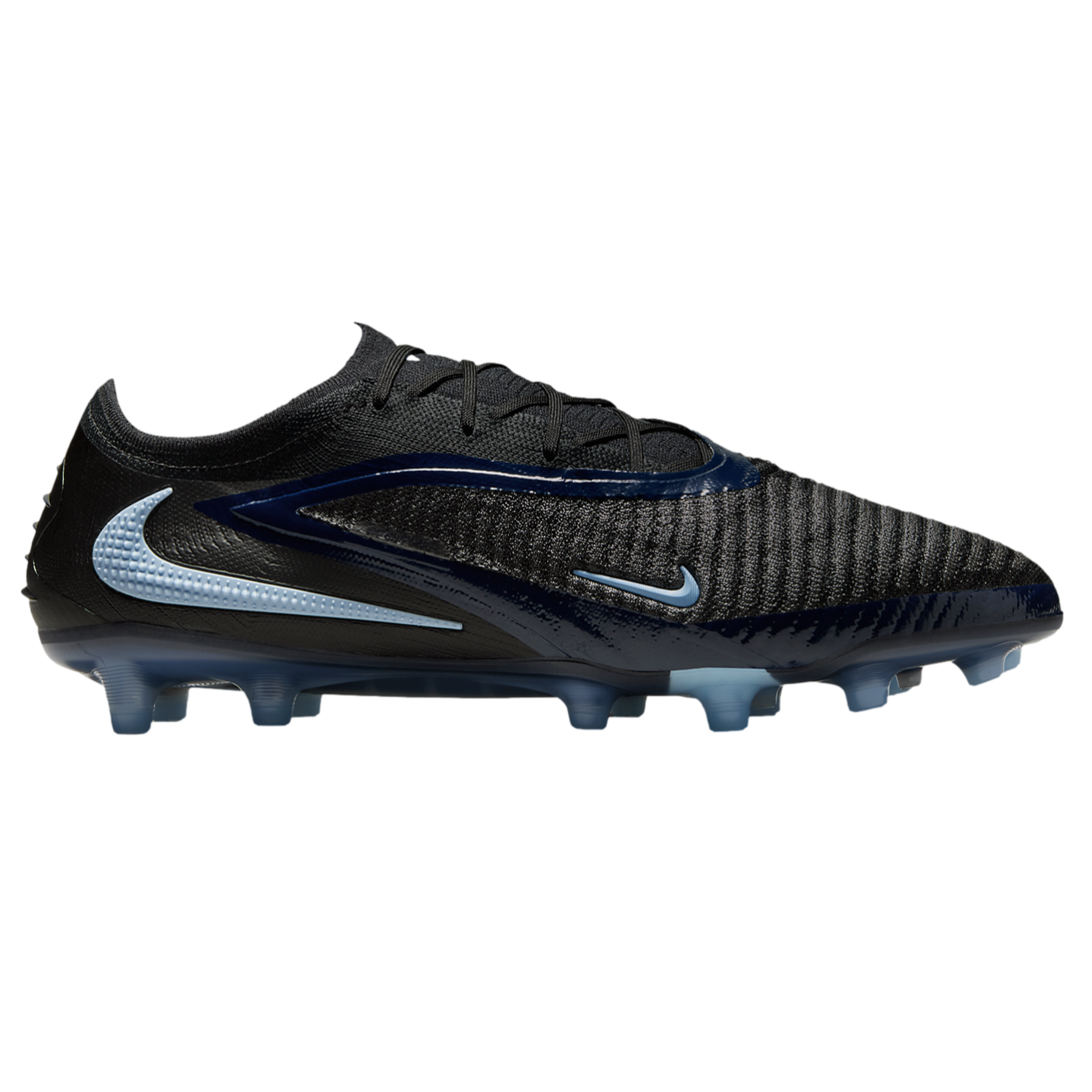 Profile view of a black and navy Nike soccer cleat with light blue swooshes, a textured knit upper, and translucent blue studs.