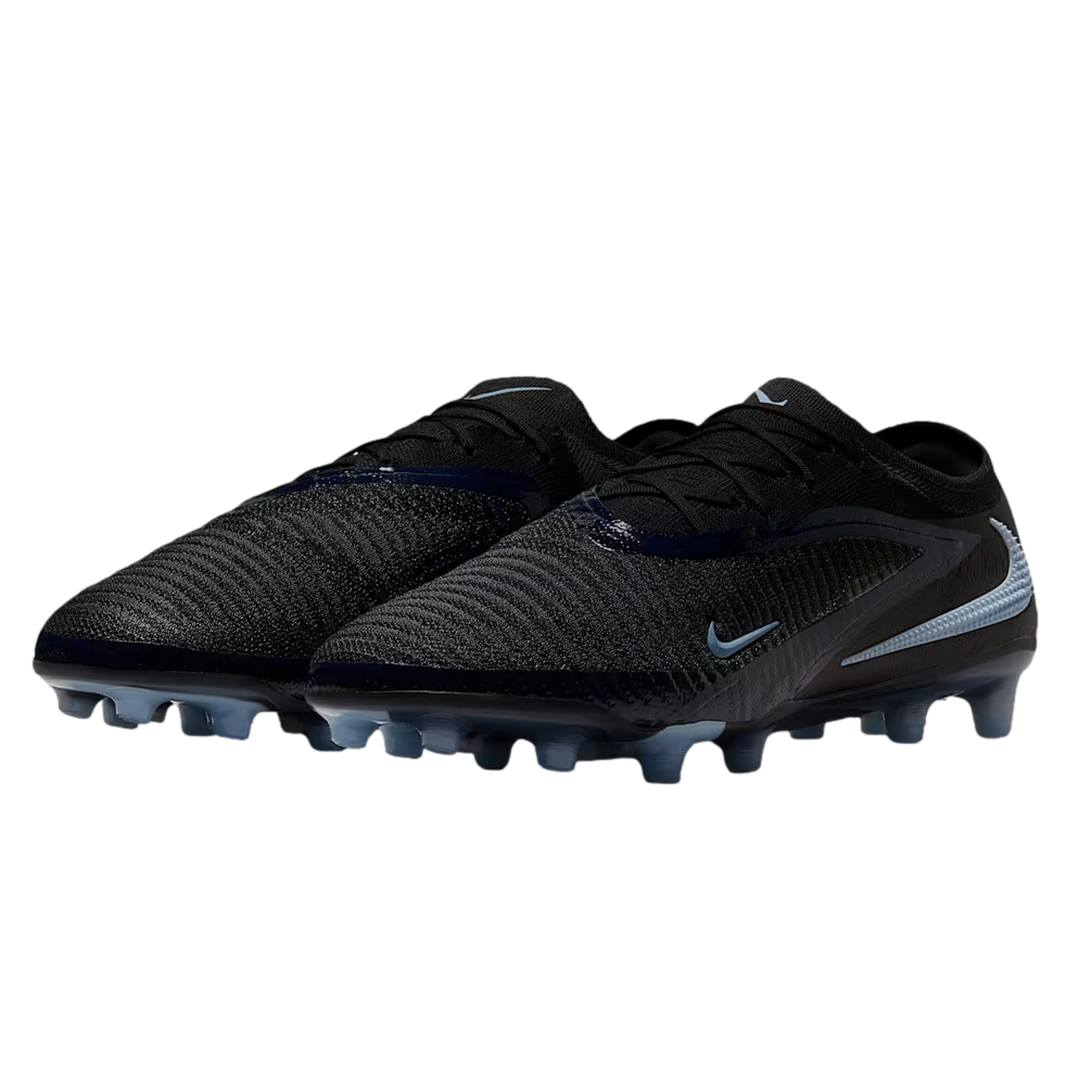 A pair of black Nike soccer cleats with light blue accents and a textured upper, set against a solid black background.