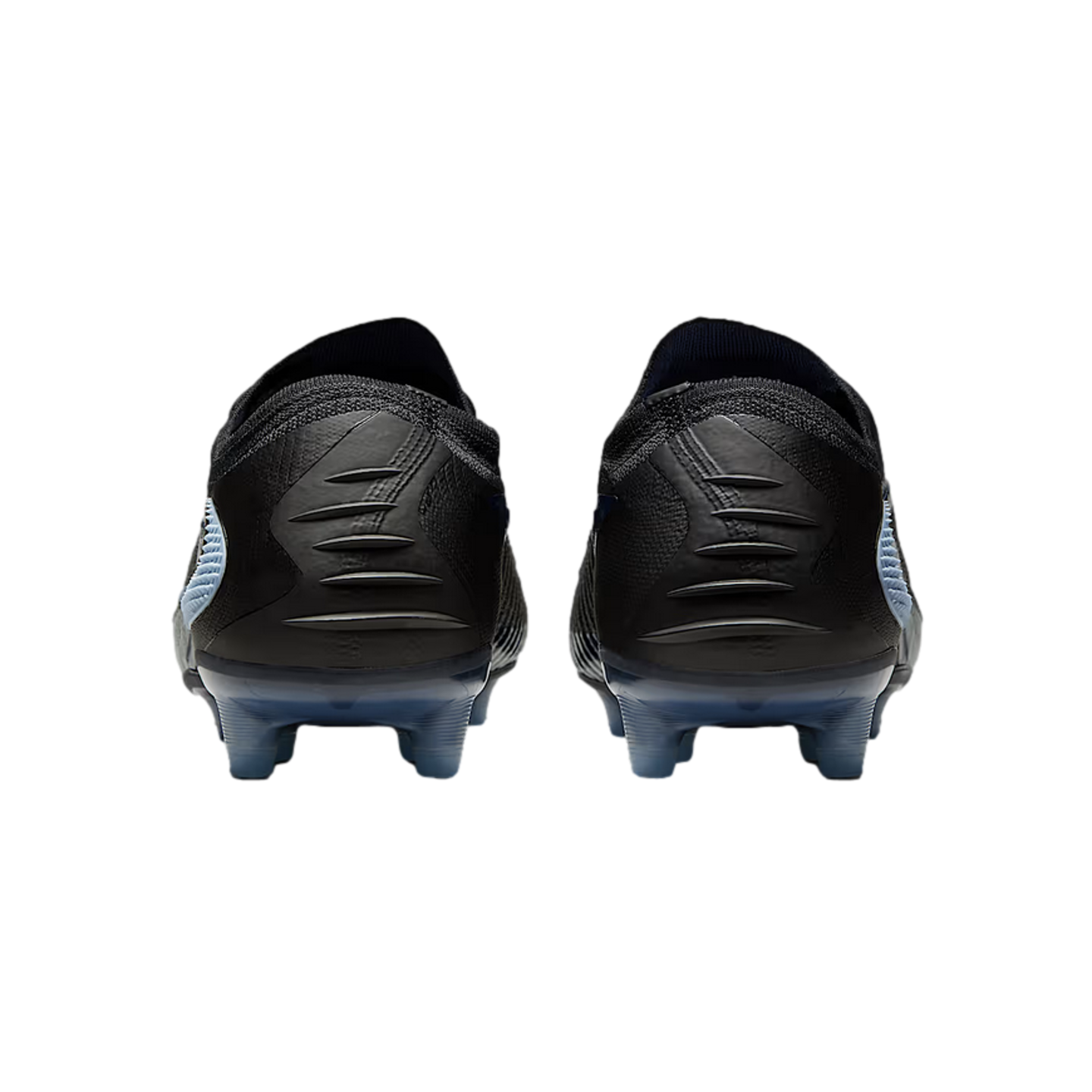 Rear view of a pair of black soccer cleats with textured heels and light blue studs against a black background.