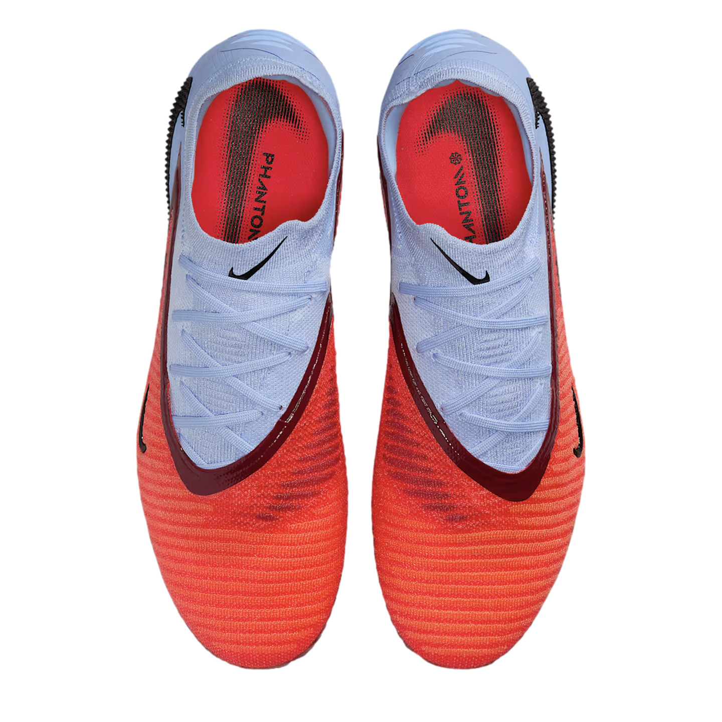 Top-down view of Nike Phantom soccer cleats in a vibrant orange and light blue colorway with dark red accents.