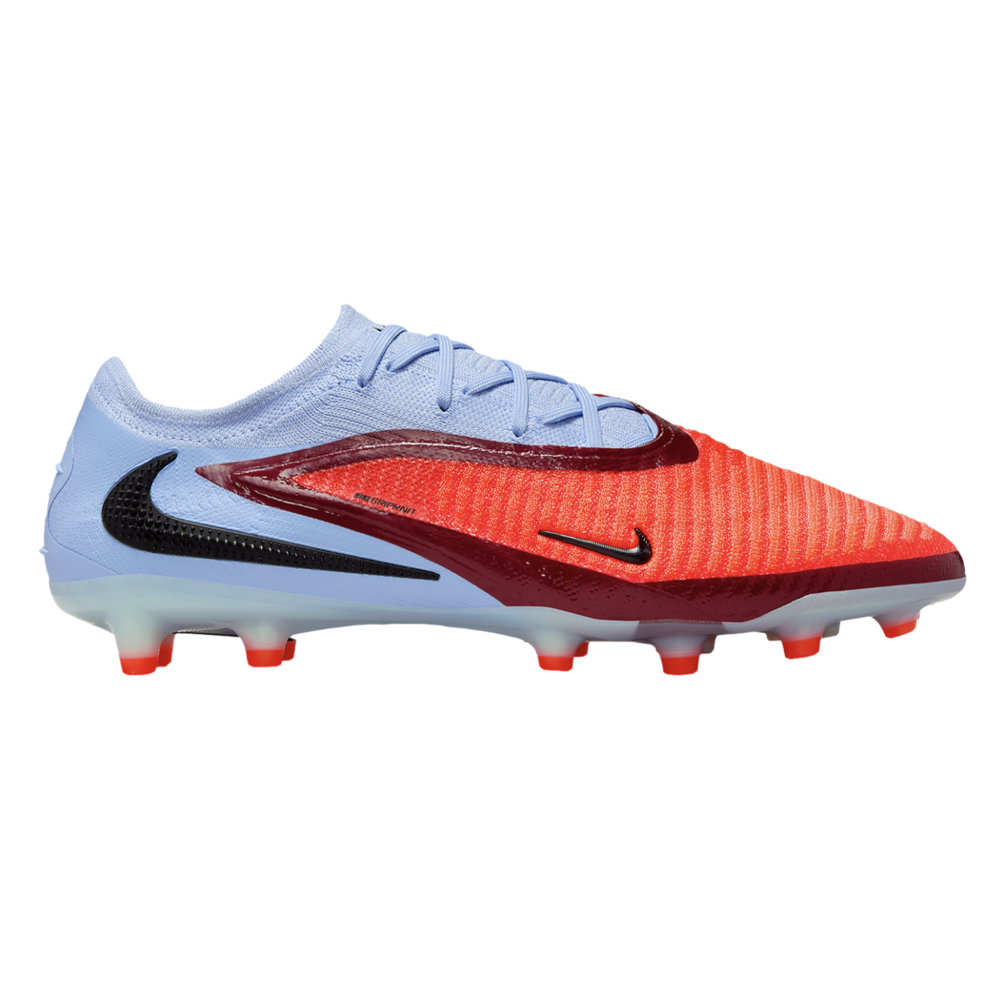 Side view of a Nike soccer cleat featuring a light blue heel, bright orange toe, maroon accents, and clear studs against a black background.