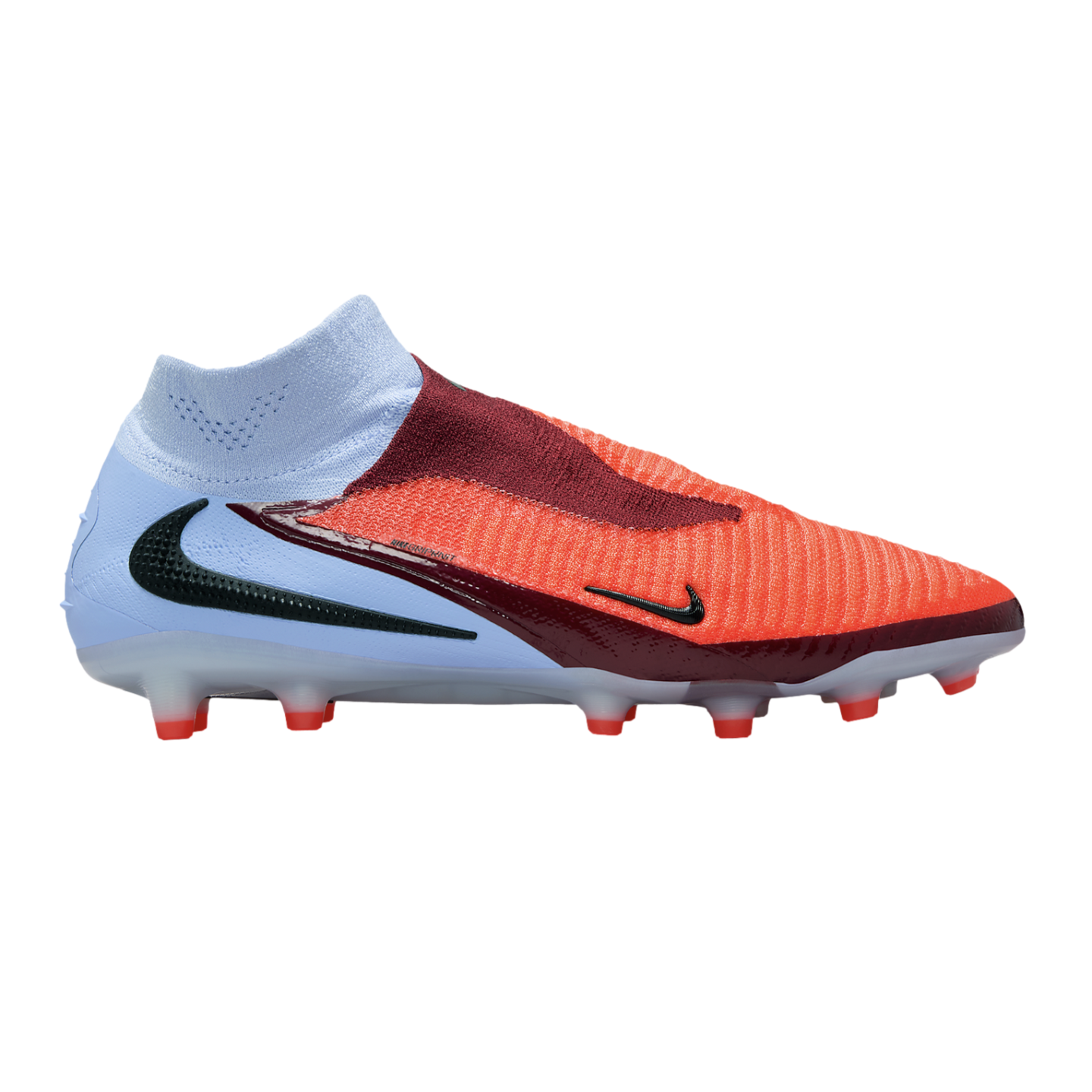 A Nike Phantom soccer cleat with a light blue collar, orange forefoot, and maroon accents. The laceless design includes a black swoosh and red studs against a black background.