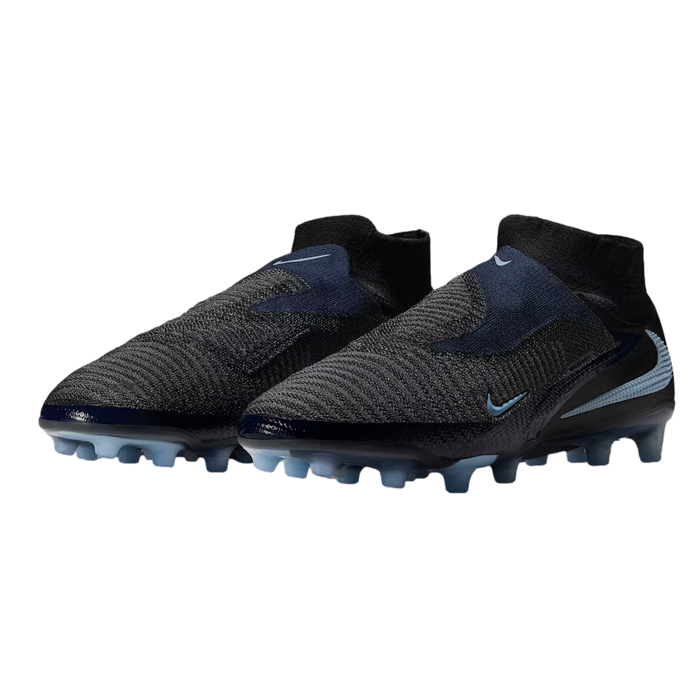 A pair of laceless Nike Phantom soccer boots in dark grey and navy blue with light blue accents, set against a black background.
