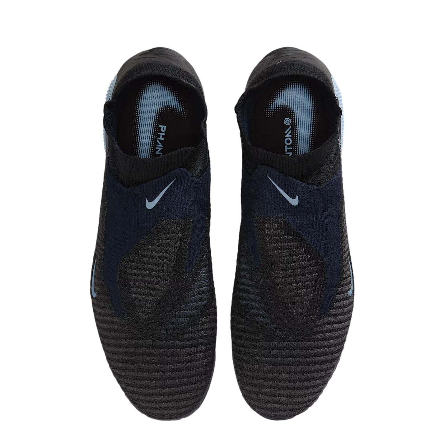 Top-down view of a pair of dark navy and black laceless Nike Phantom soccer boots with light blue accents, set against a black background.