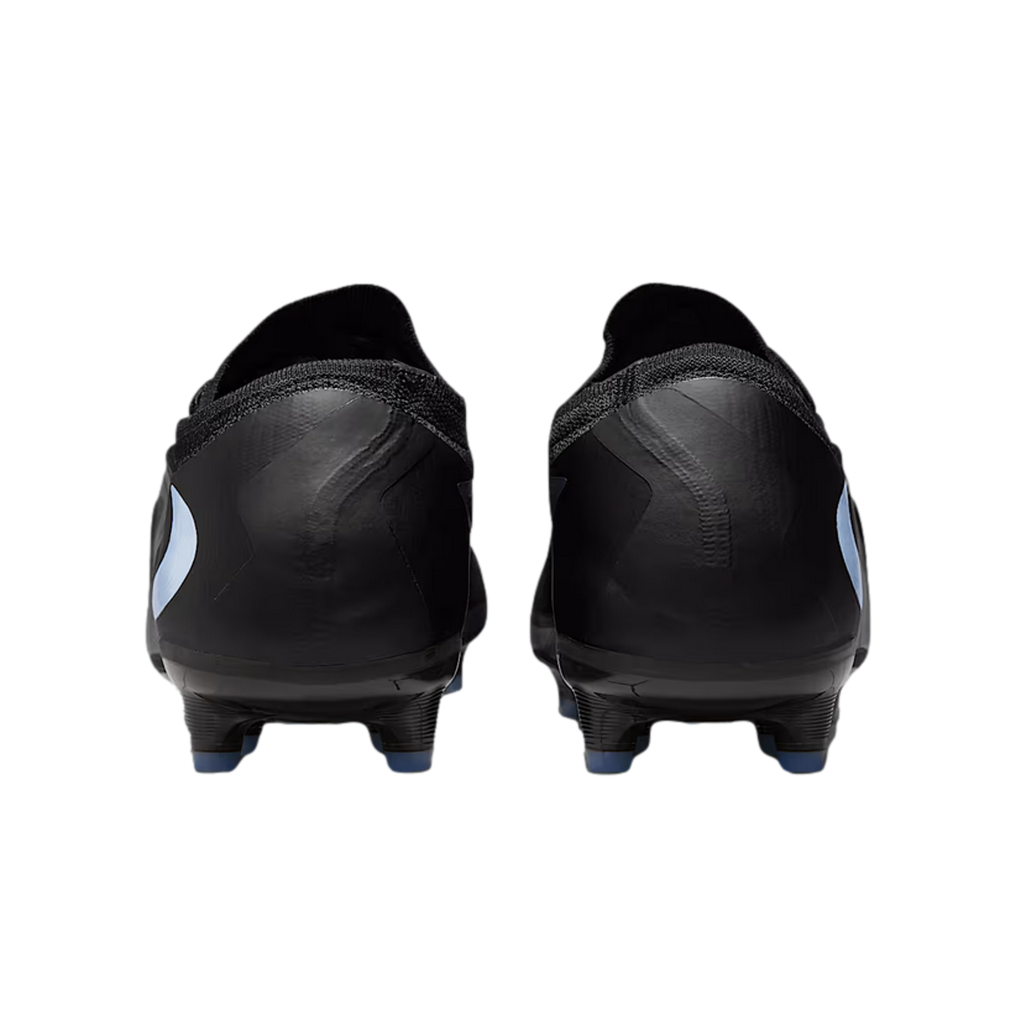 Rear view of a pair of black soccer cleats with light blue accents and a textured knit collar, set against a solid black background.