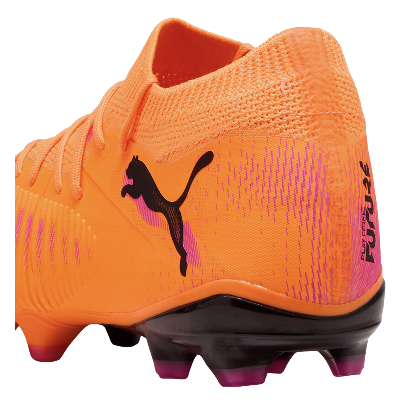 Bright orange Puma soccer cleat with a black cat logo, pink accents, and black studs with purple tips. The heel features the text "PLAY FREE FUTURE."