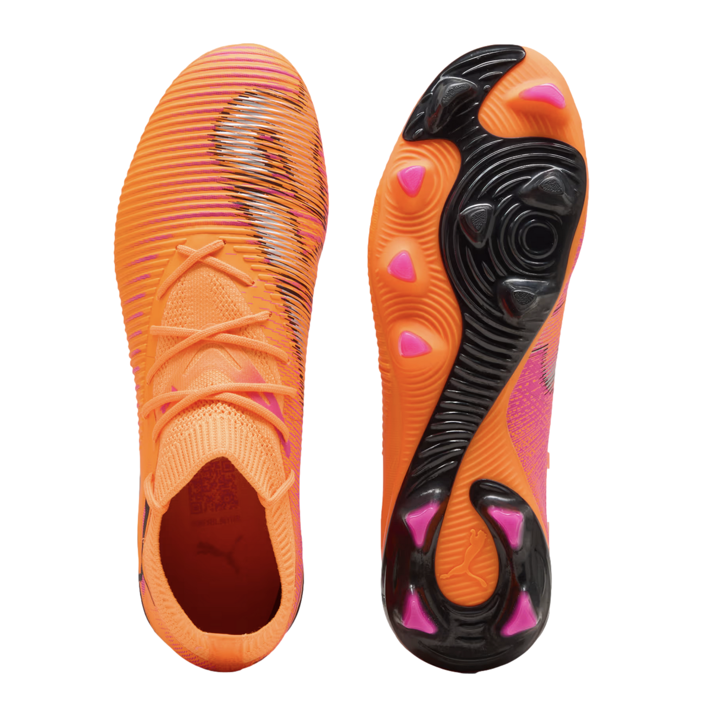 Top and bottom views of bright orange Puma soccer cleats featuring black textured stripes and pink-tipped studs on the sole.