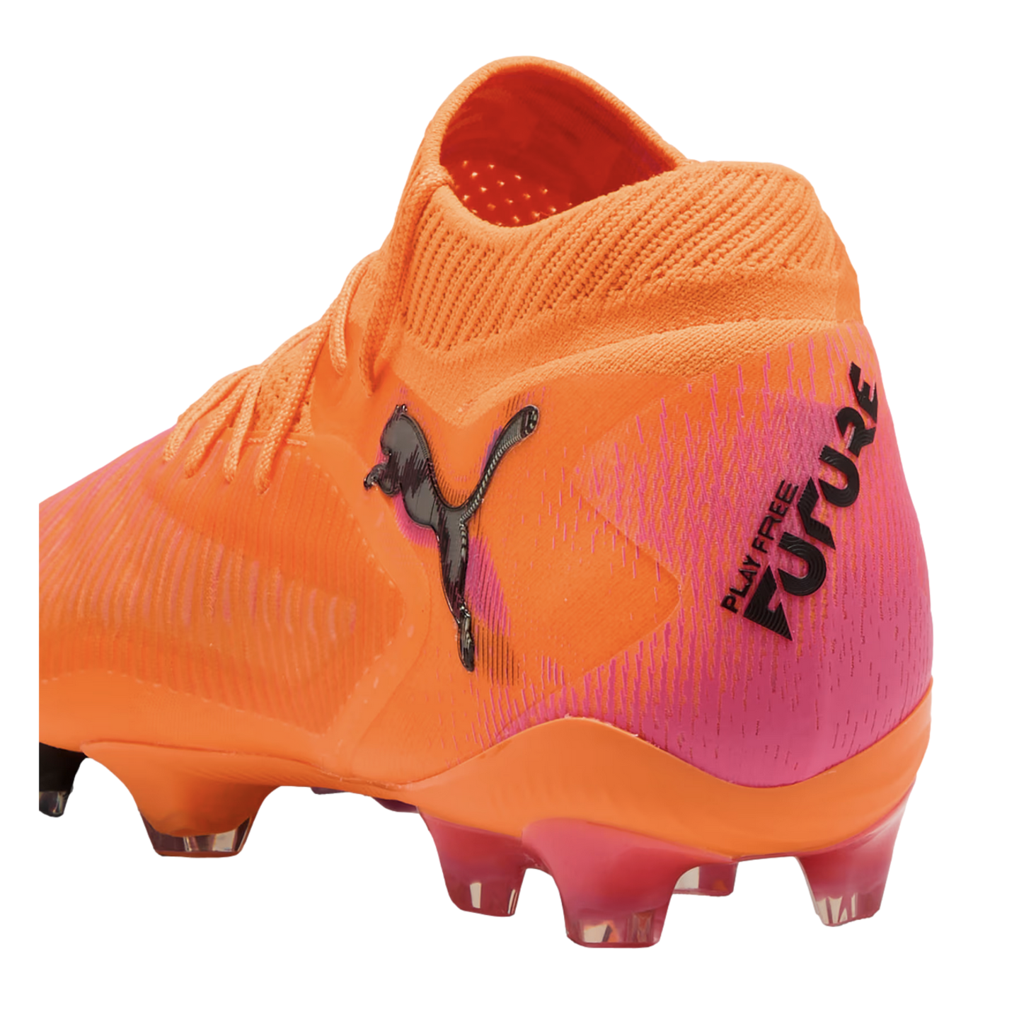 An orange and pink Puma Future soccer cleat with a textured upper, black Puma logo, and "PLAY FREE FUTURE" text on the heel.