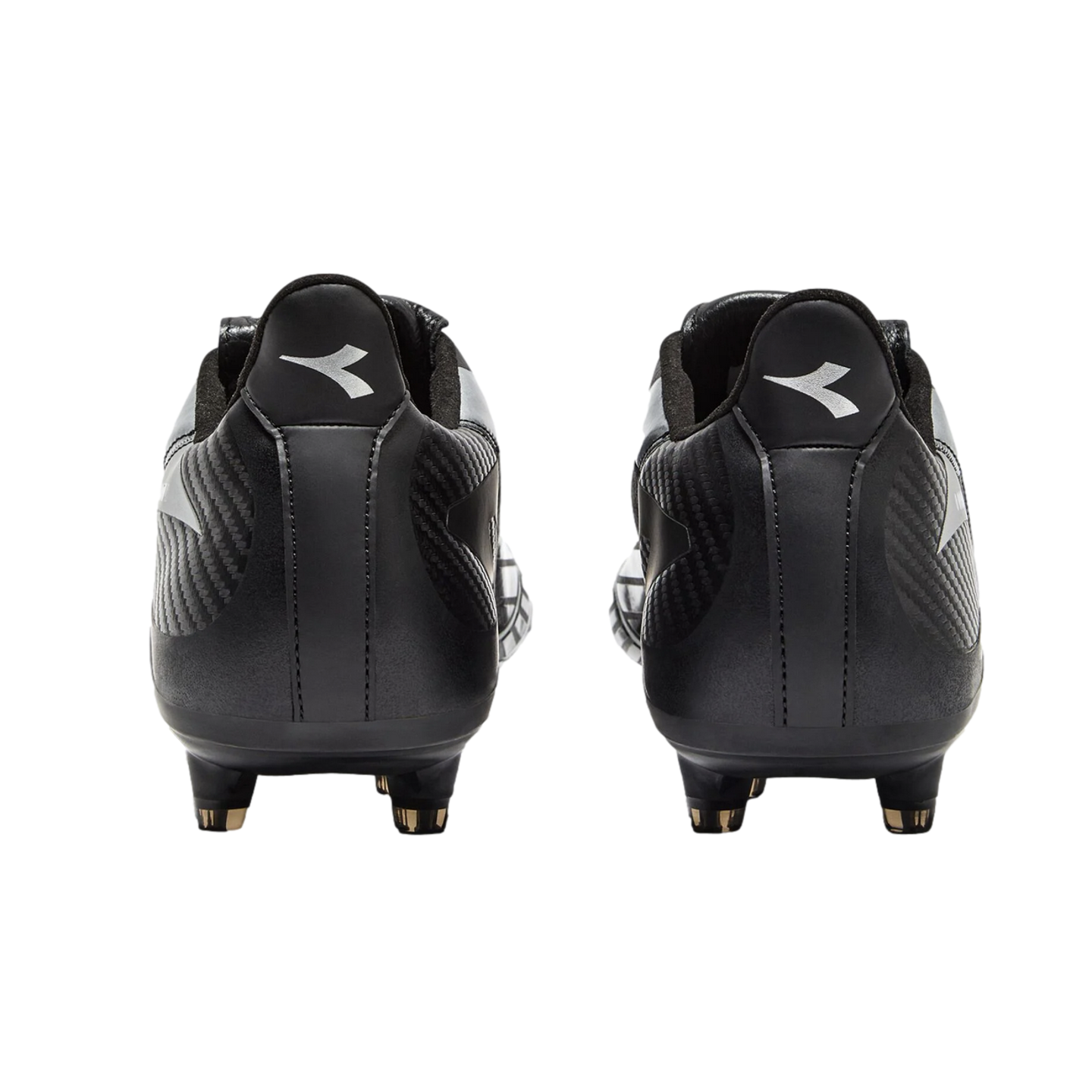 A rear view of black Diadora soccer cleats against a black background, with the white brand logo visible on each heel.