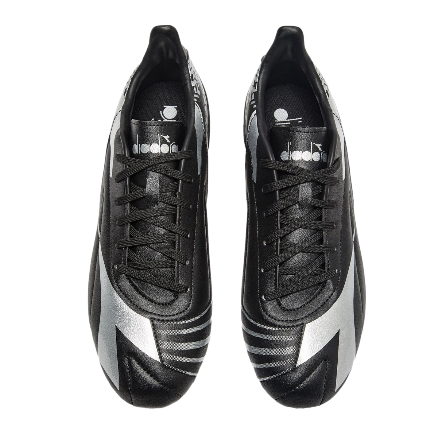 Top-down view of black Diadora soccer cleats featuring silver accents and branding, isolated on a black background.