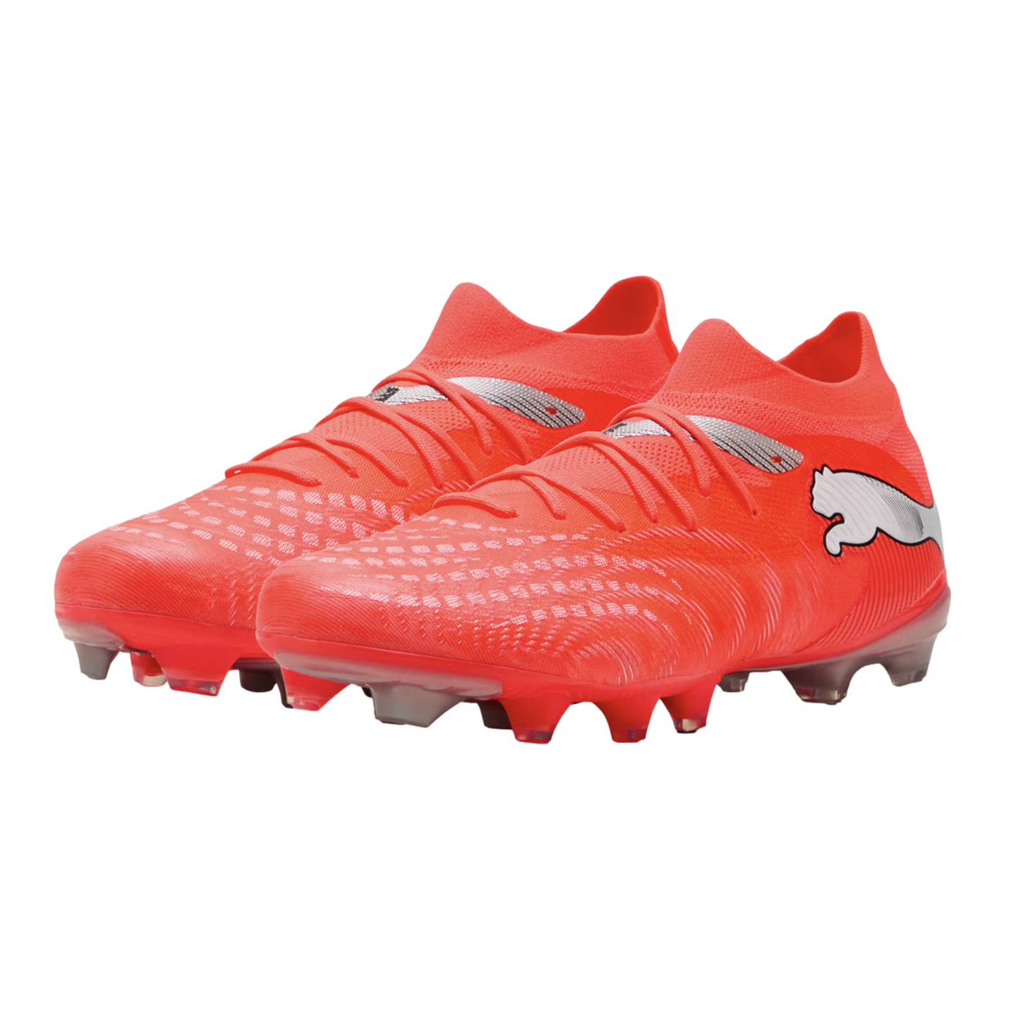 A pair of vibrant orange Puma soccer boots with silver logo accents and textured uppers, shown from a three-quarter view against a black background.