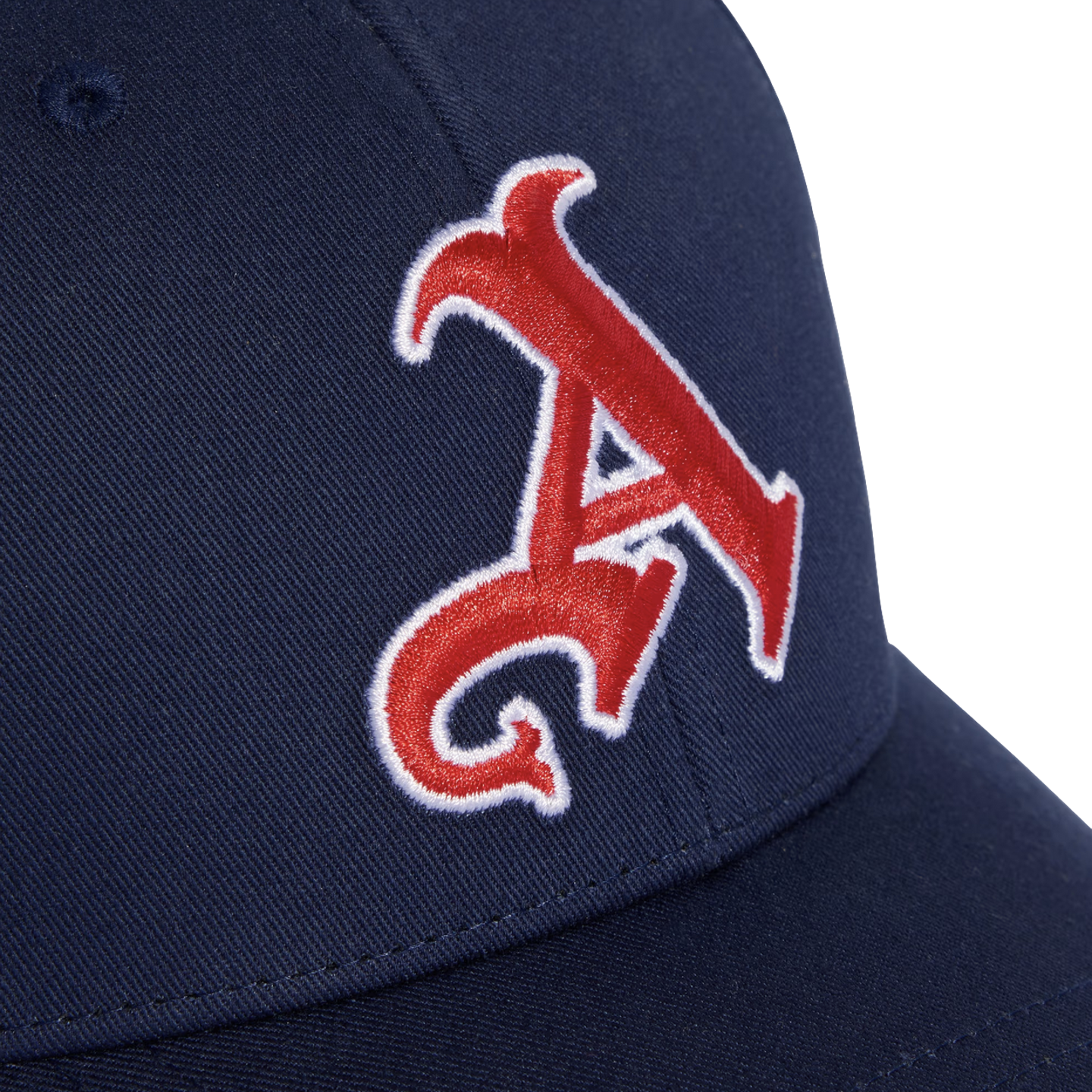 Close-up of a navy blue baseball cap with a stylized red letter 'A' embroidered on the front with a white outline.