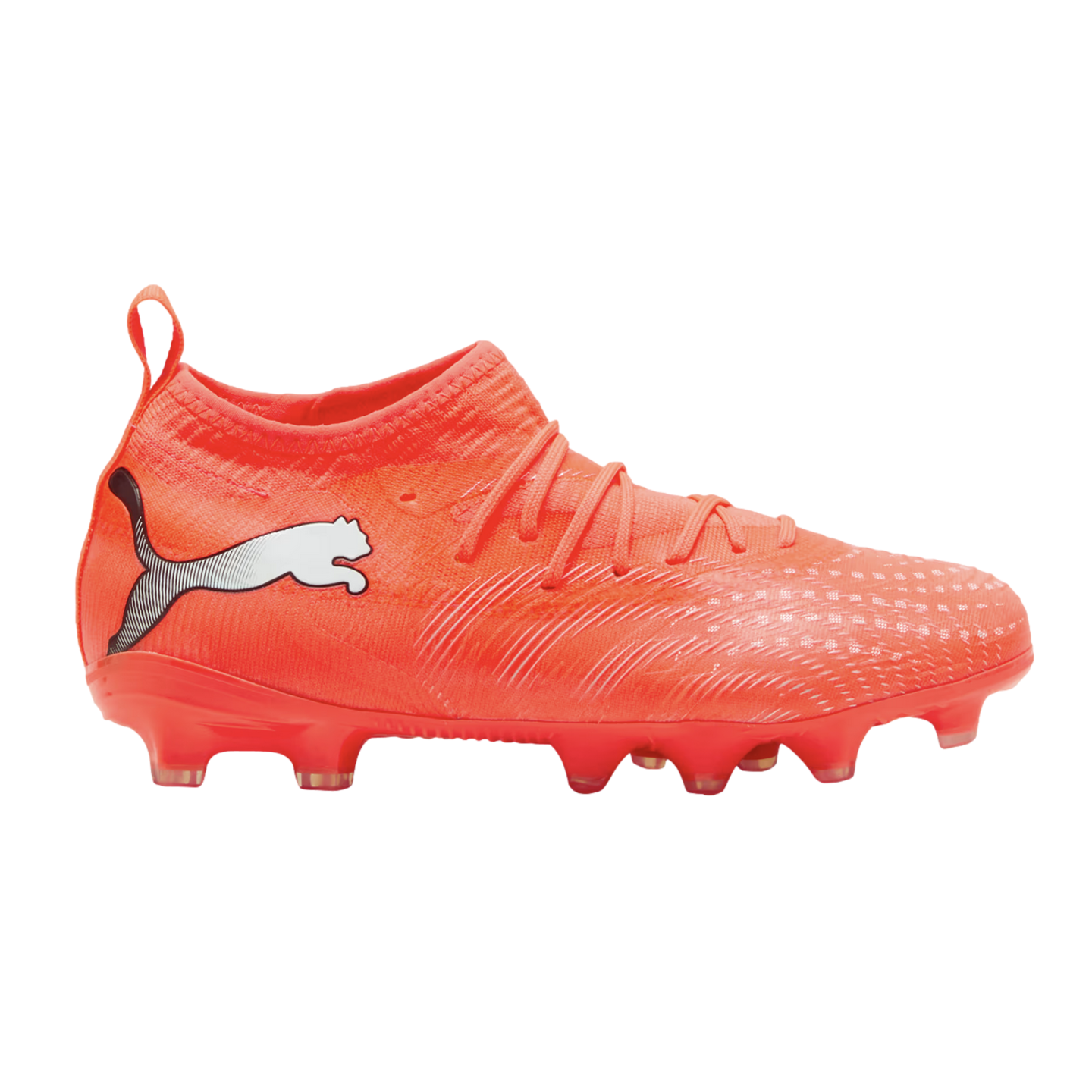 Side profile of a bright orange Puma soccer cleat with a white logo on the heel, textured upper, and studded sole against a black background.