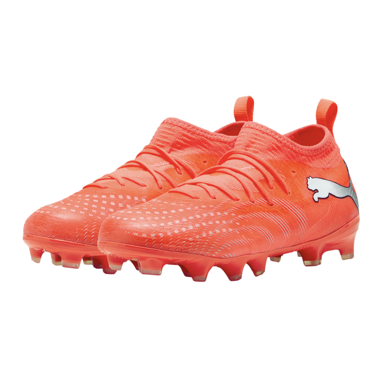A pair of bright orange Puma soccer cleats featuring a silver logo, textured upper, and integrated sock-like collar, shown against a solid black background.