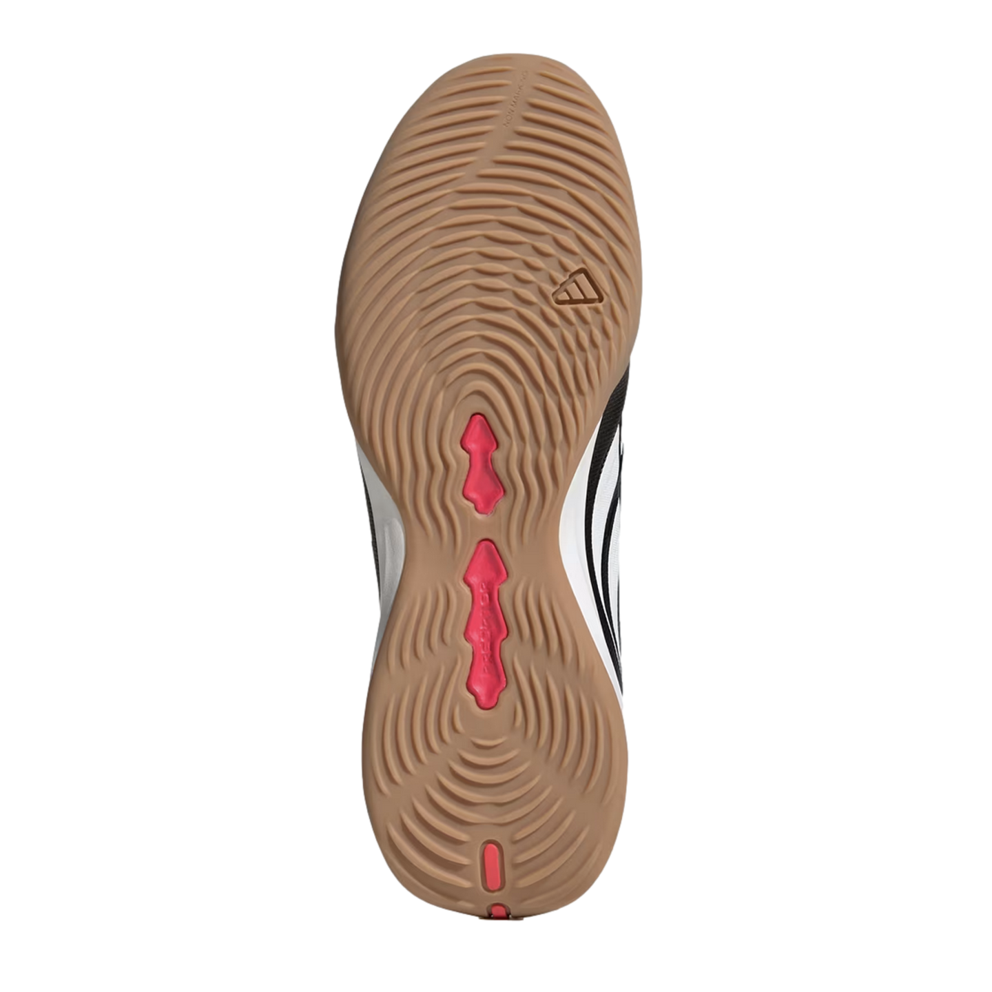 Tan gum rubber outsole of an indoor soccer shoe with concentric circular grip patterns, pink central accents, and a small Adidas logo.
