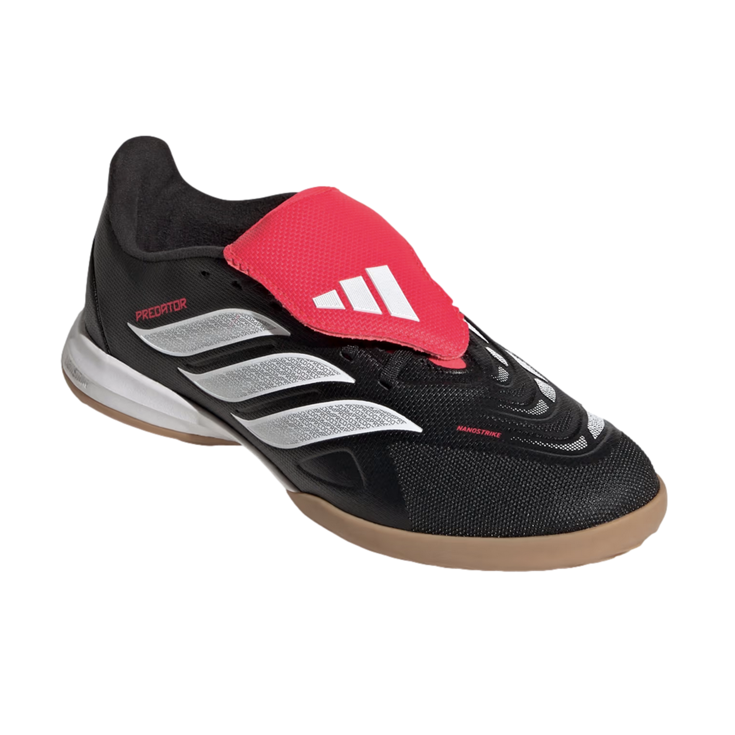 Black Adidas Predator indoor soccer shoe featuring three silver side stripes, a bright red fold-over tongue with a white logo, and a tan gum rubber sole.