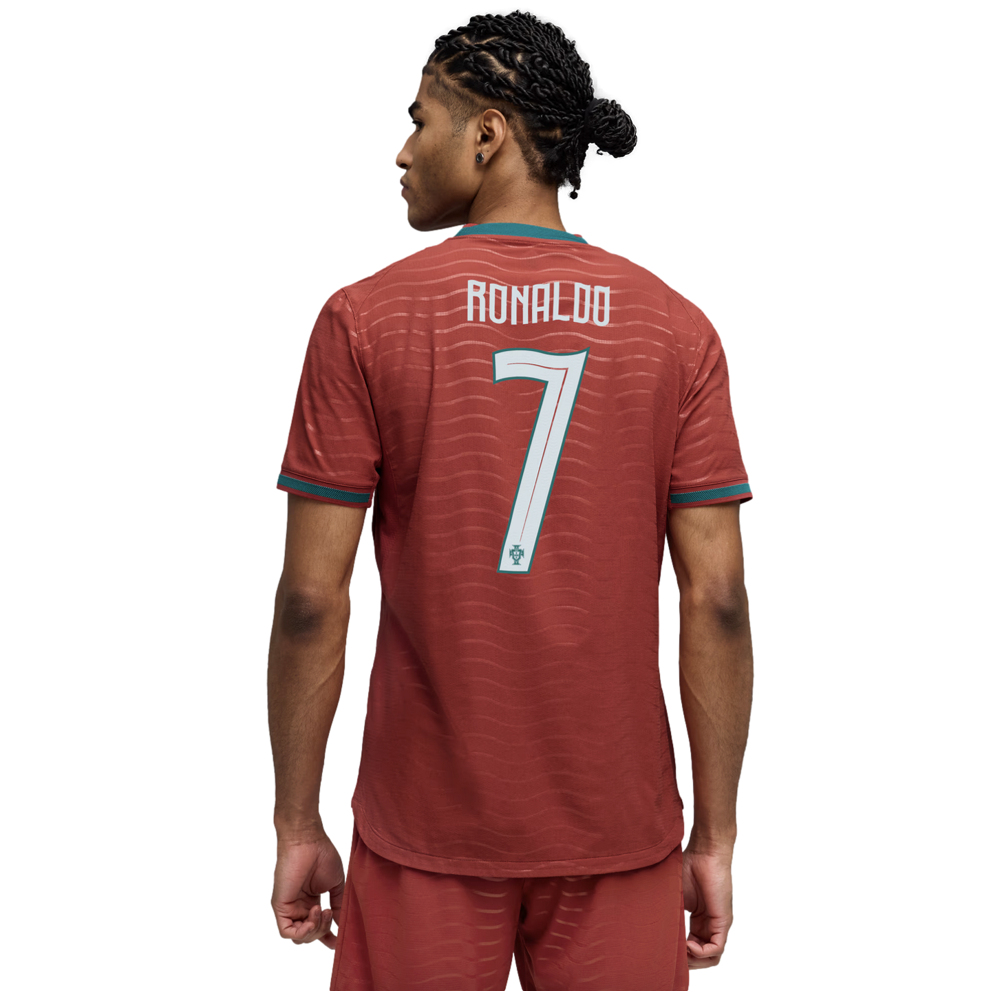Back view of a man wearing a red Portugal jersey with "RONALDO" and "7" on the back. He has dark braided hair and is set against a black background.