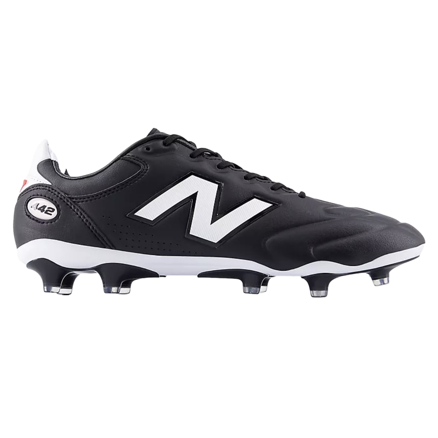 A side view of a black New Balance 442 soccer boot featuring a large white logo, a white midsole, and black studs with clear tips against a solid black background.