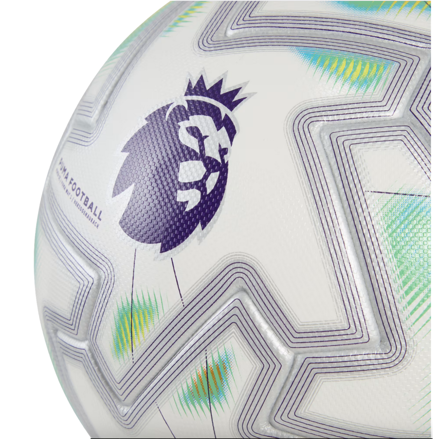 Close-up of a white Puma soccer ball featuring the purple Premier League lion logo and geometric line patterns.