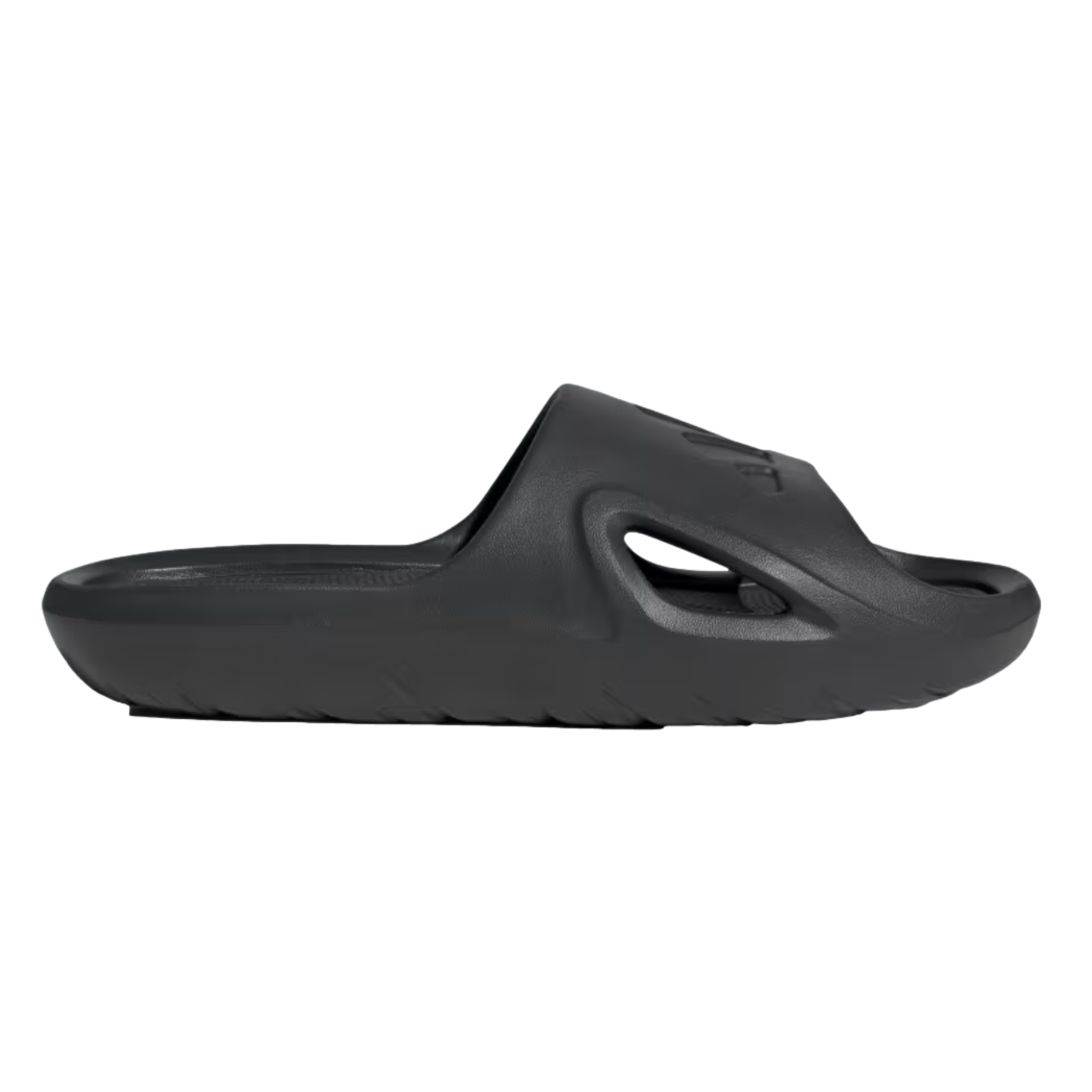 Profile view of a single all-black slide sandal featuring a thick, contoured sole and a side cutout on the strap.