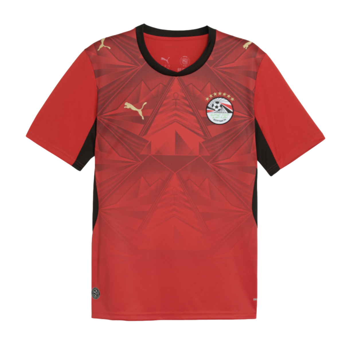 Red Puma Egypt football jersey with a geometric pyramid pattern, black trim, and the national team crest with seven stars.