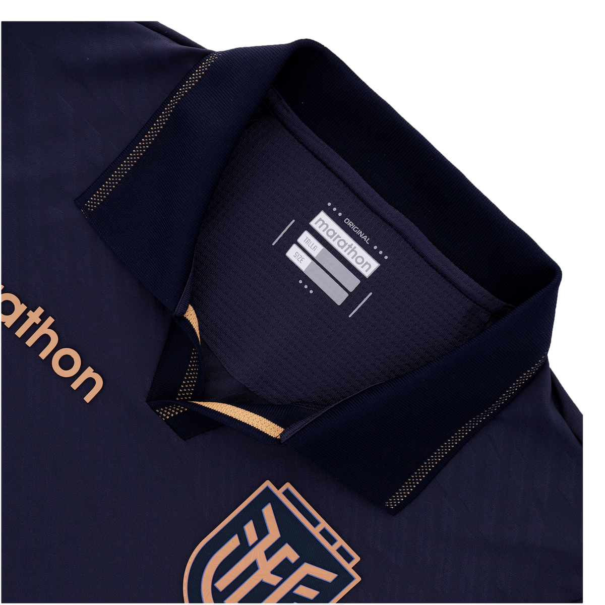 A close-up of the collar and upper chest of a navy blue sports jersey. It features a polo collar with copper-gold dotted trim, the "marathon" brand name on the chest and an inner tag, and a portion of a geometric crest at the bottom.