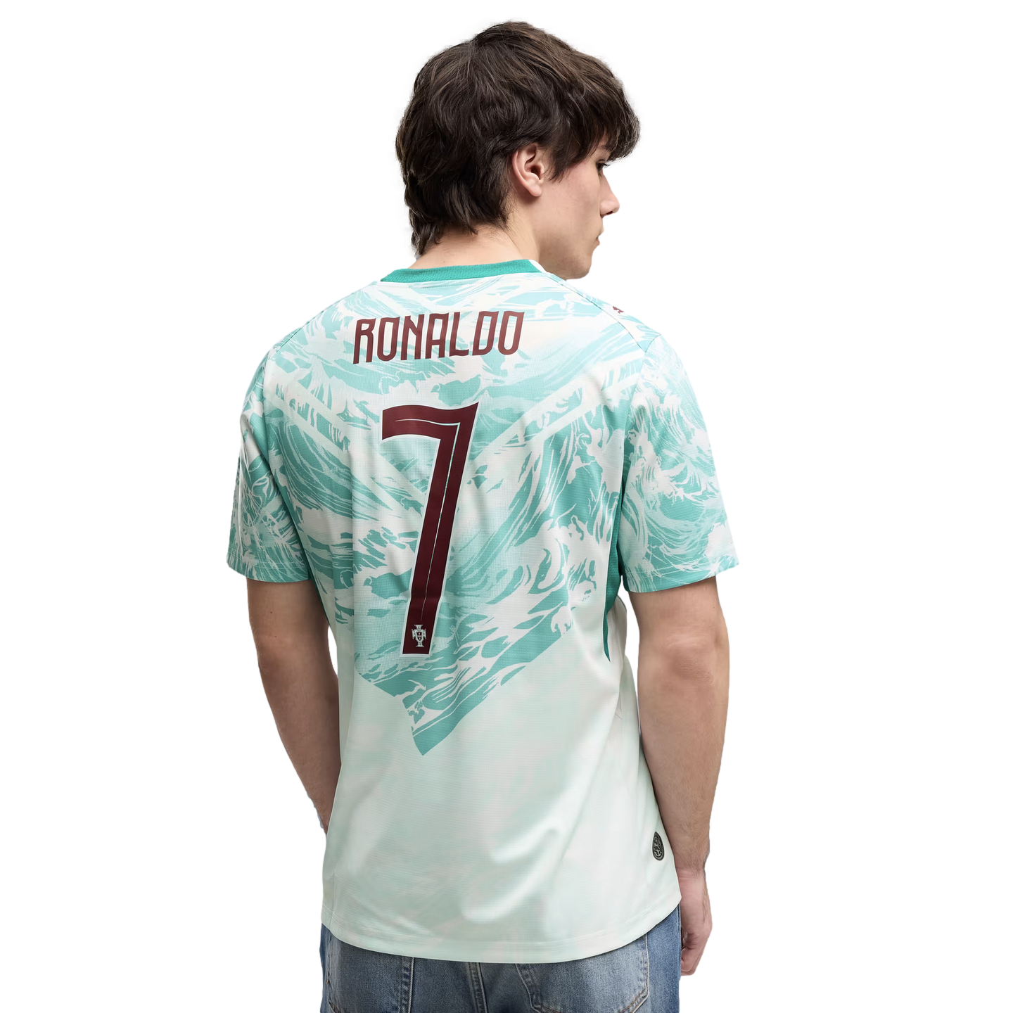 Back view of a man wearing a mint green and white patterned Portugal soccer jersey with "RONALDO" and the number "7" in maroon on the back.