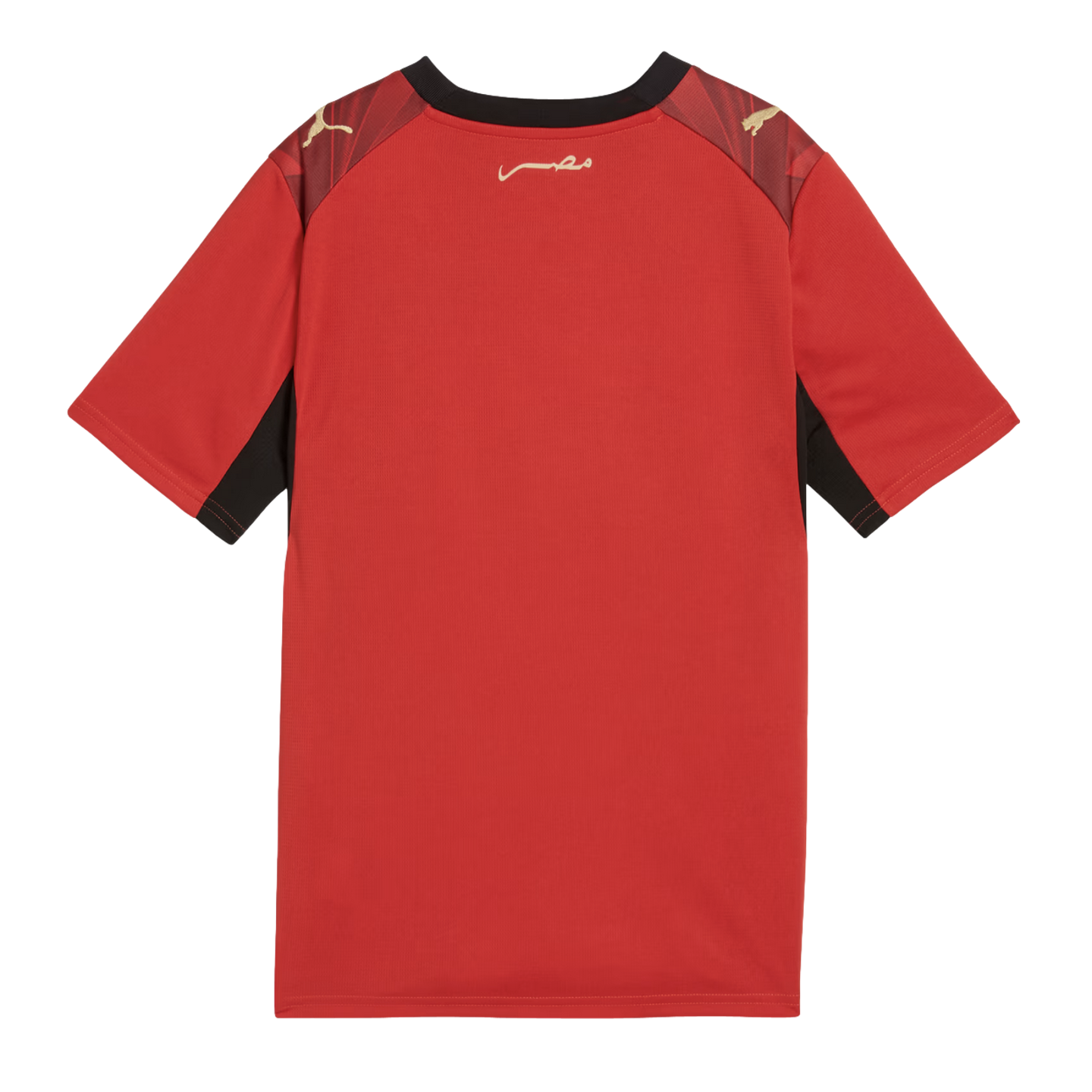 A back view of a red short-sleeved Puma jersey with black trim around the collar and underarms. It features gold Puma logos on the shoulders and gold Arabic calligraphy on the upper back against a black background.