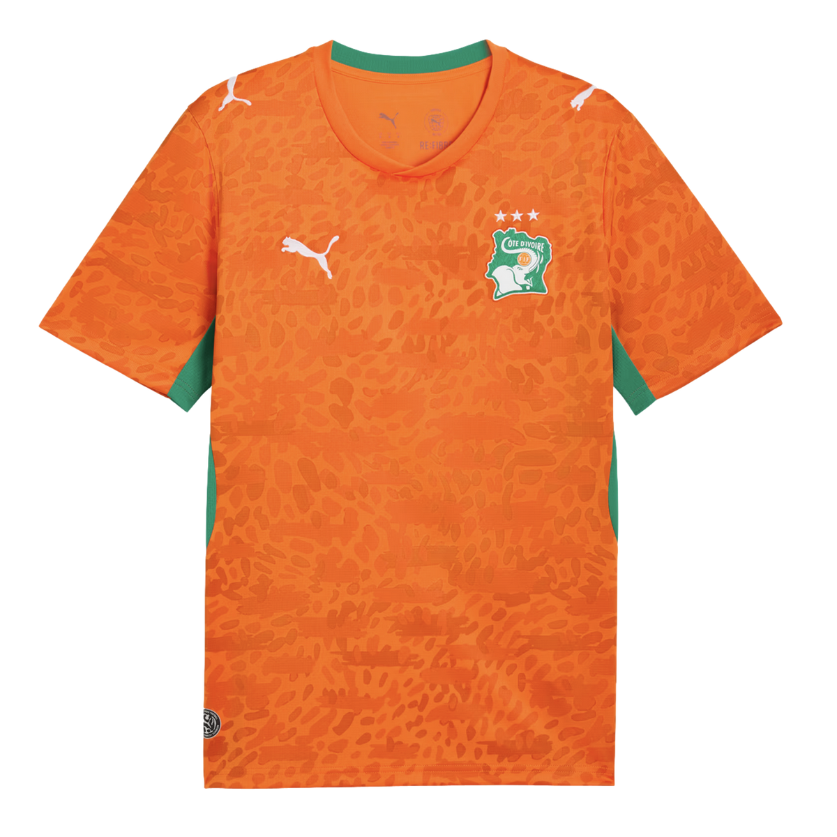 An orange Puma soccer jersey for the Côte d'Ivoire national team. It features an all-over tonal leopard print pattern, a green collar, and green side panels. The team's elephant crest with three stars is on the left chest, and white Puma logos are on the