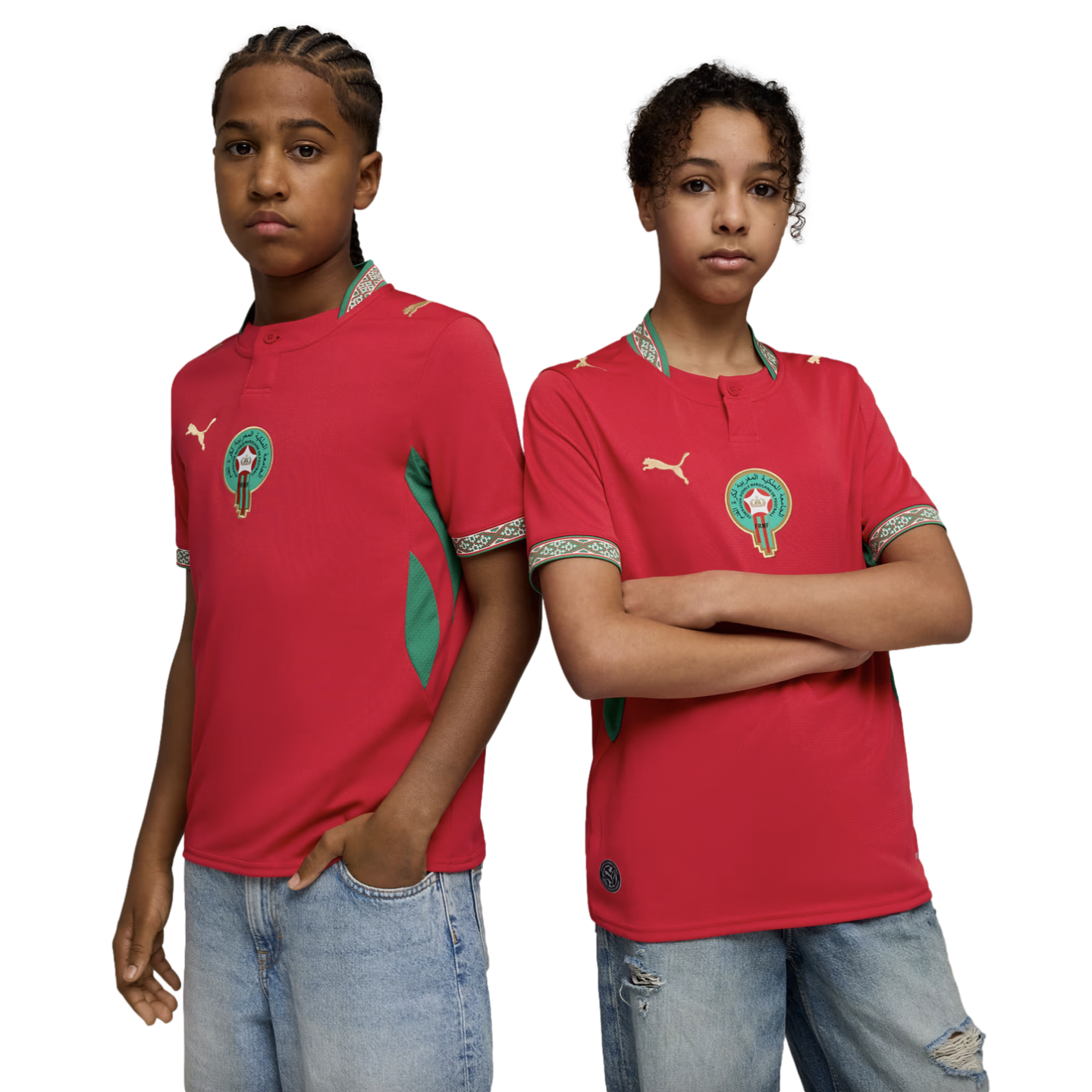 Two young people pose side-by-side against a black background, wearing red Moroccan national football team jerseys and light-wash denim jeans.