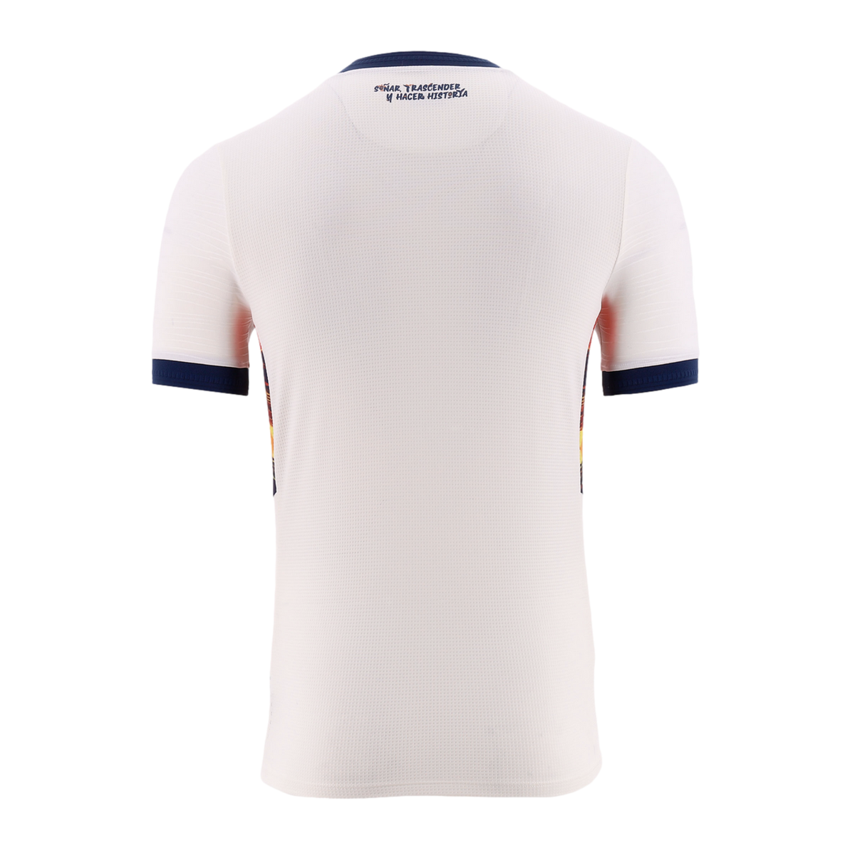 Back view of a white short-sleeved sports jersey with navy blue trim on the collar and sleeve cuffs. A Spanish slogan is printed in blue below the neckline, and colorful graphic panels are visible on the sides.
