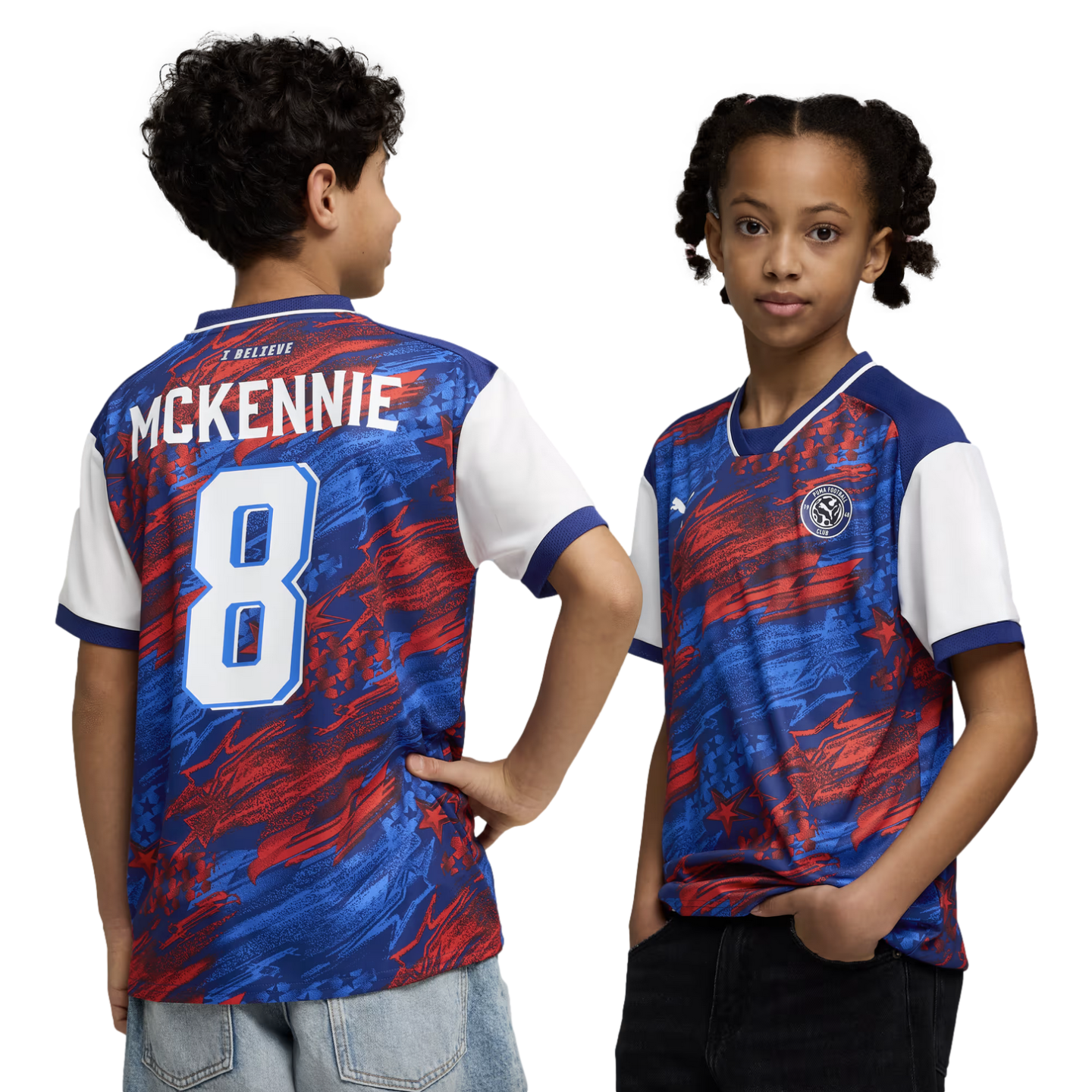 A boy and a girl model a red, blue, and white abstract-patterned soccer jersey against a black background. The boy on the left shows the back of the shirt, which features the name "MCKENNIE" and the number "8" in white. The girl on the right shows the fro
